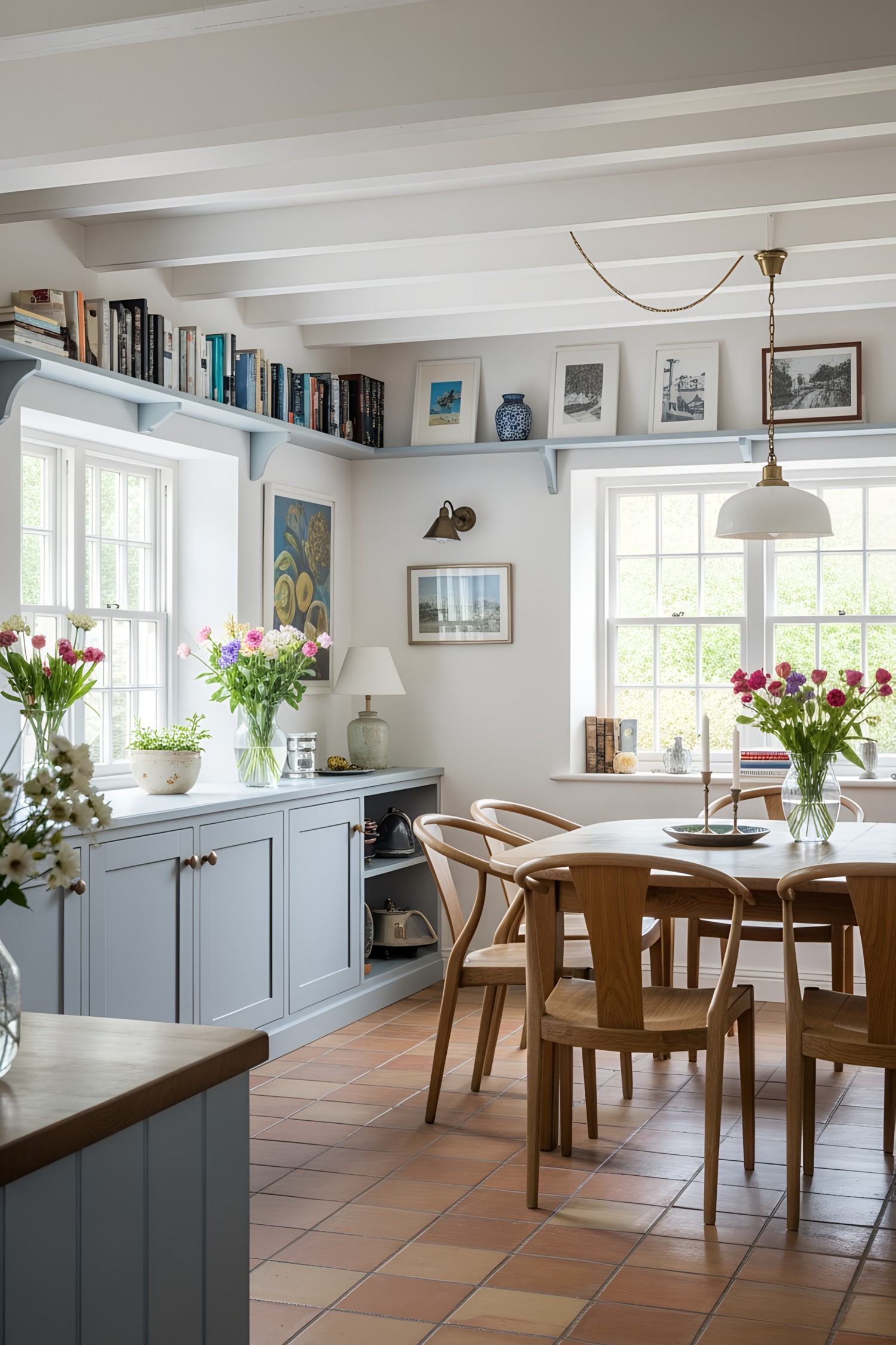 Cozy kitchen corner with wooden chairs and floral accents