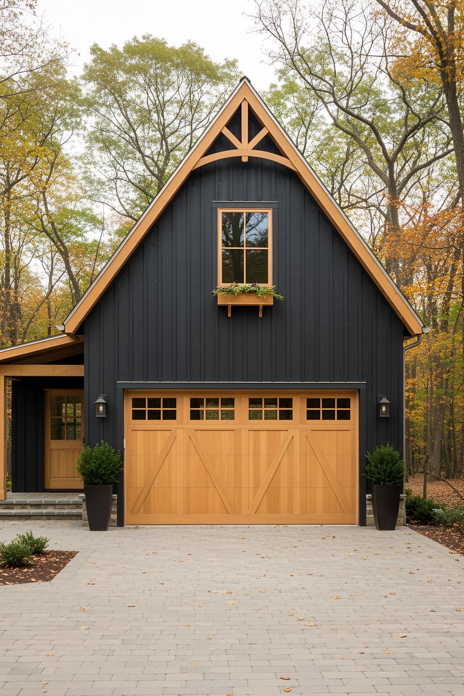Farmhouse with wooden garage doors