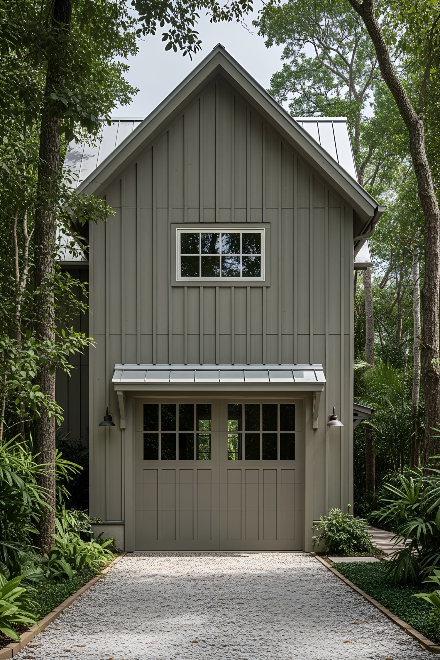 Modern farmhouse with a garage surrounded by greenery