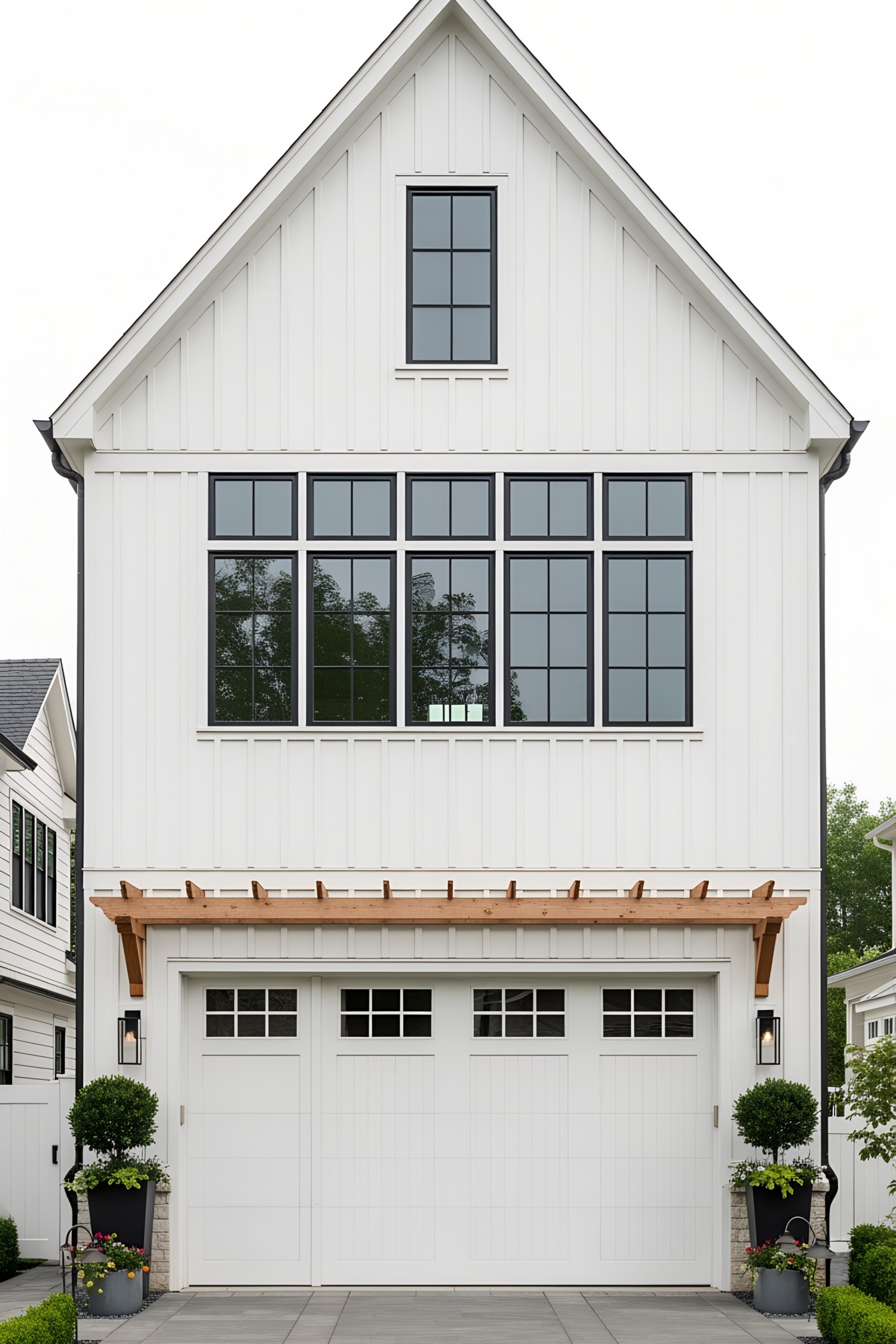 Bright white farmhouse with attached garage