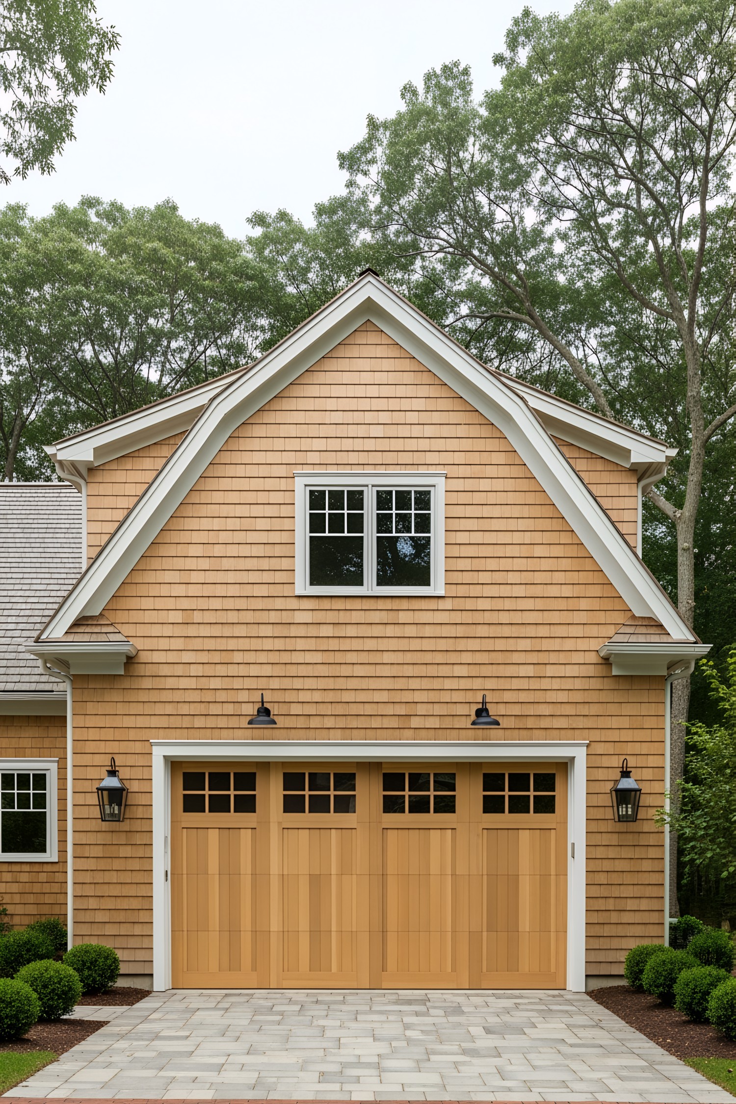 Farmhouse facade with wooden garage doors