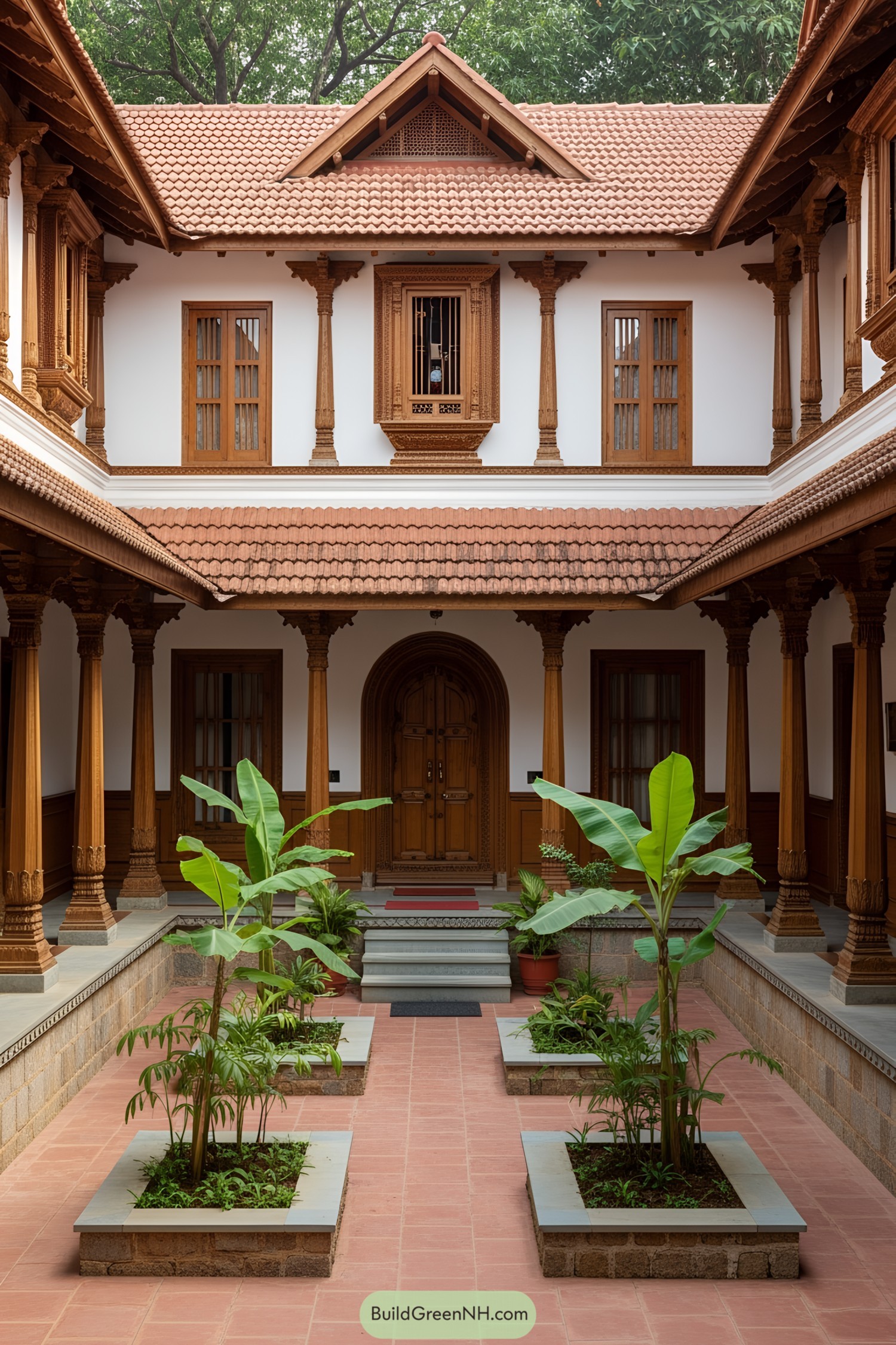 An Indian courtyard with wooden pillars and lush green plants