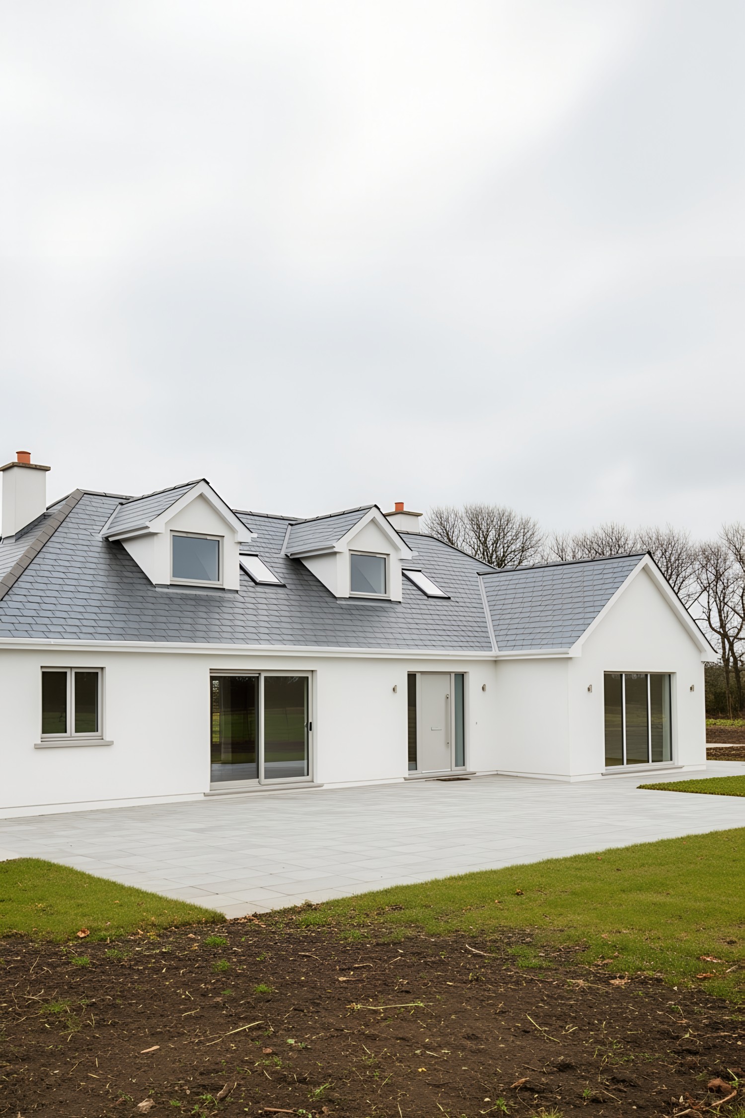 Modern white Irish bungalow with a slate roof