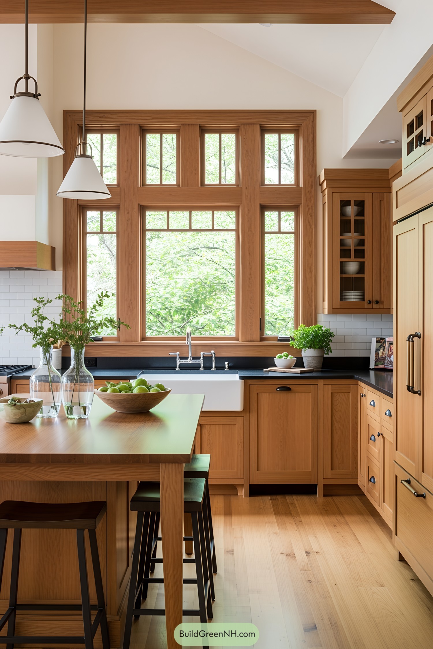 Warm wood kitchen with large windows and farmhouse sink