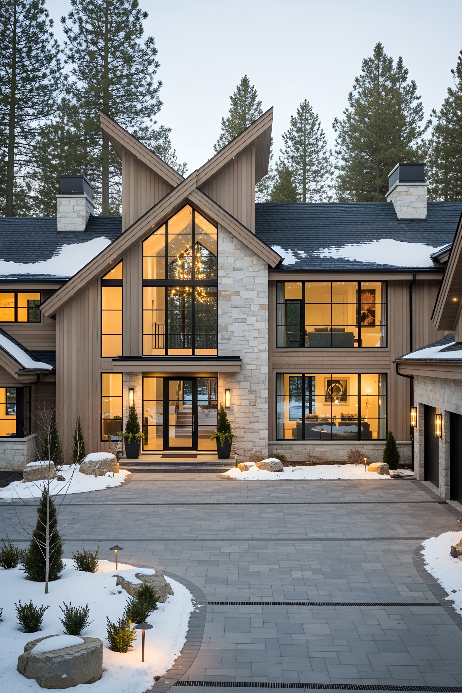 Luxurious chalet with large windows amidst a snowy landscape