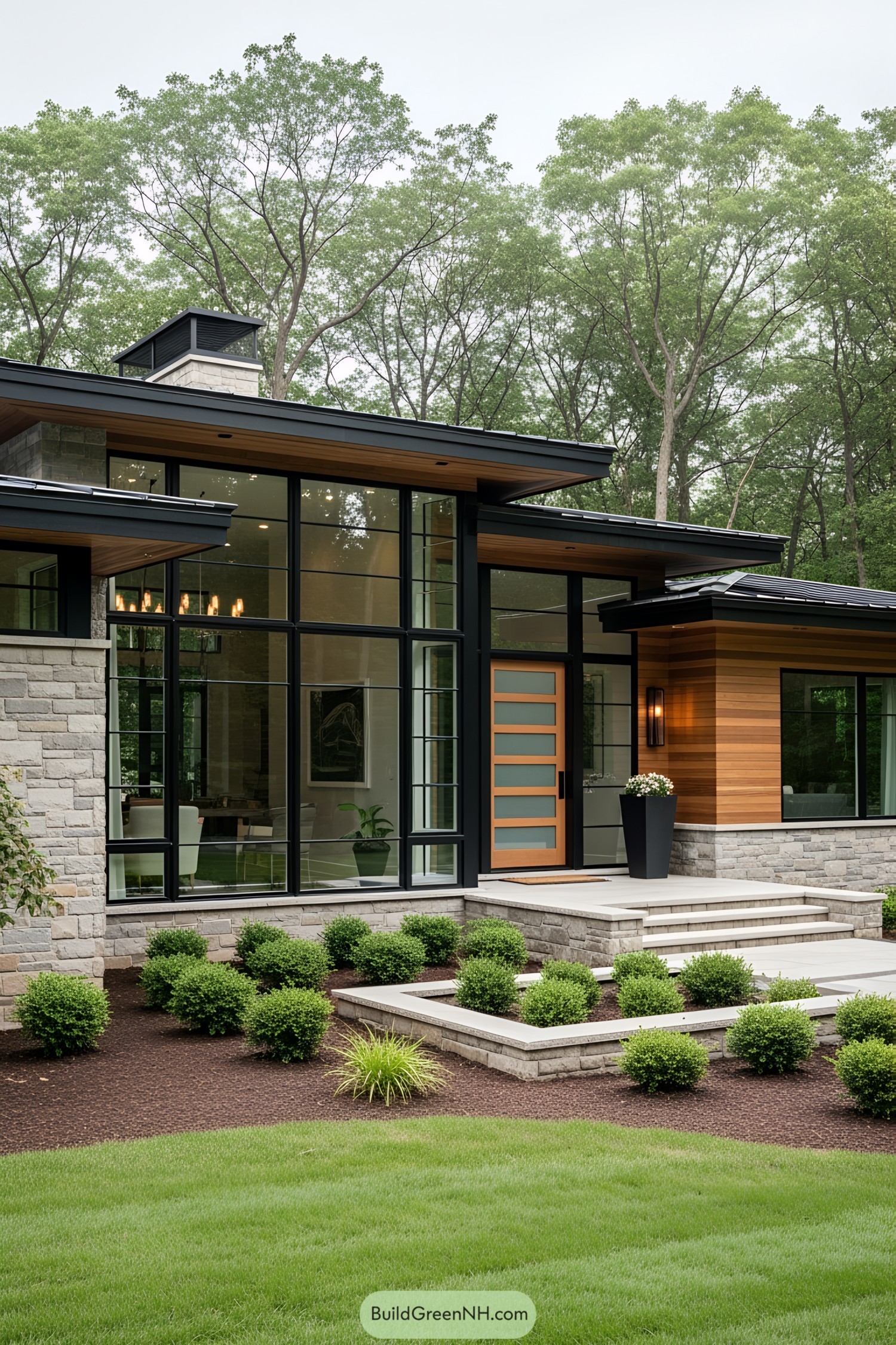 Modern one-story home with large windows and lush landscaping