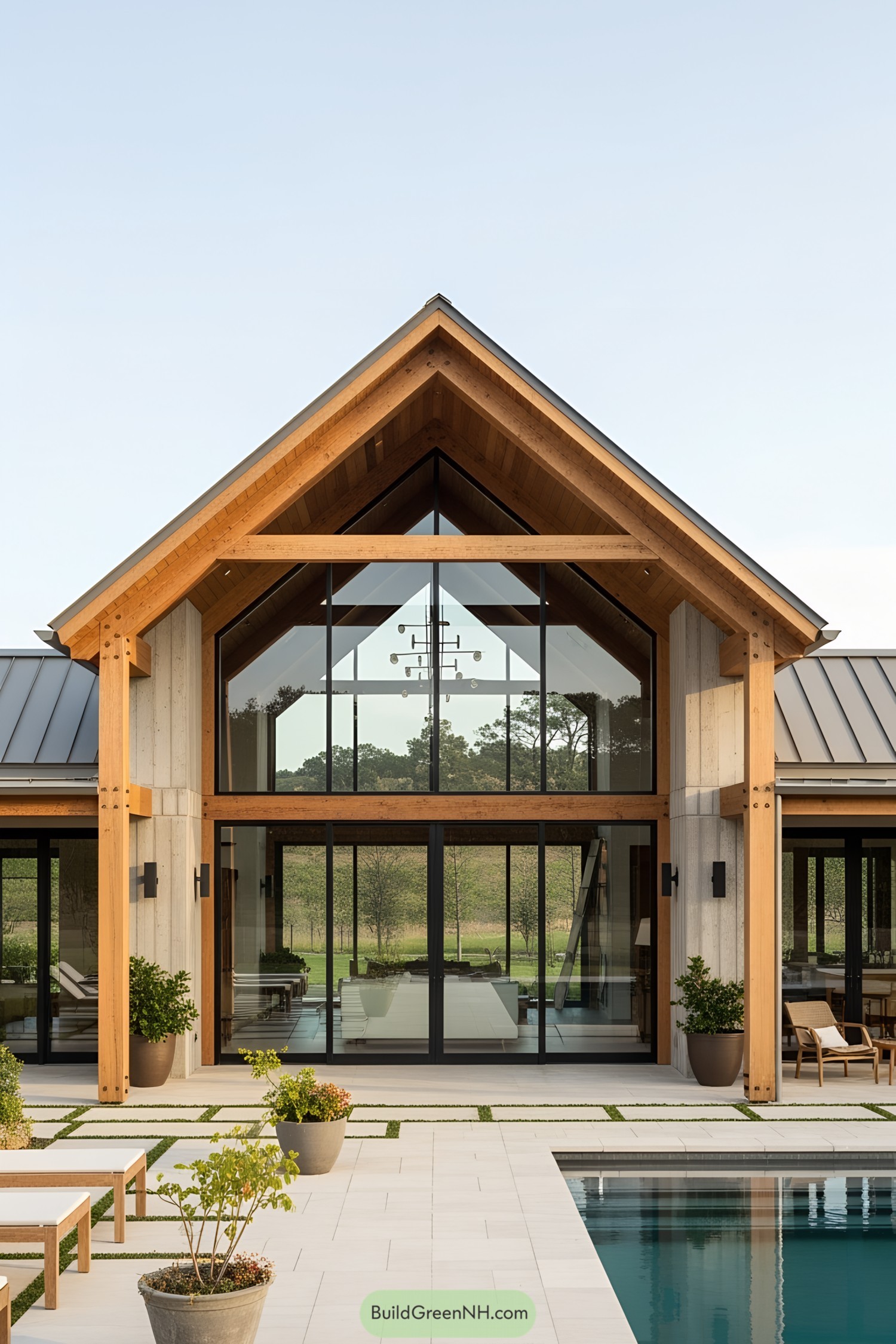 Glass-fronted pool house with wooden beams