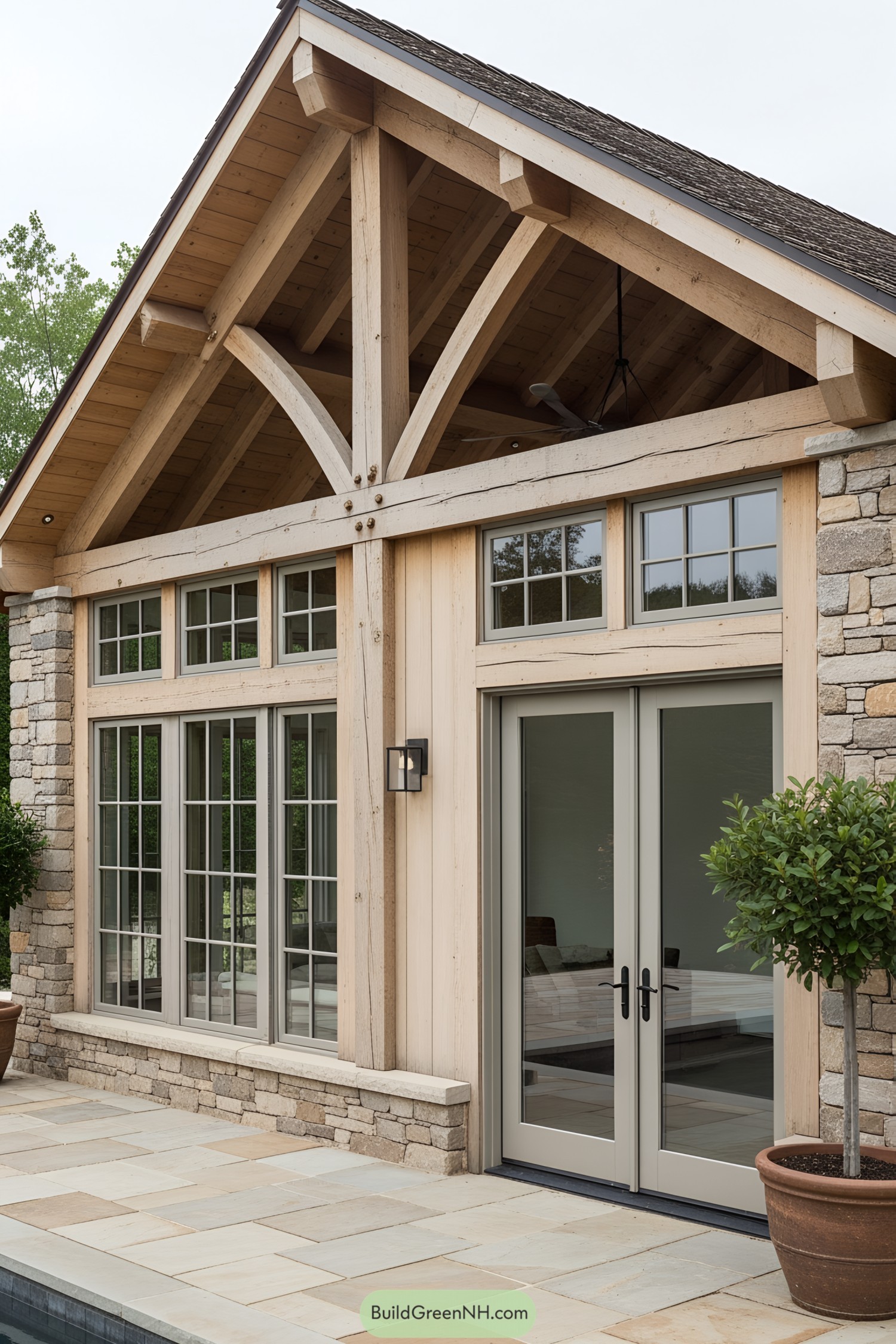 Modern pool house with stone and wood design