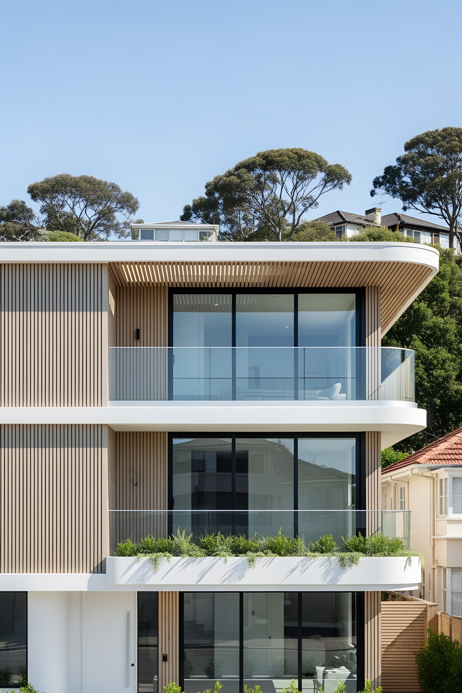 Sleek modern facade with glass balconies