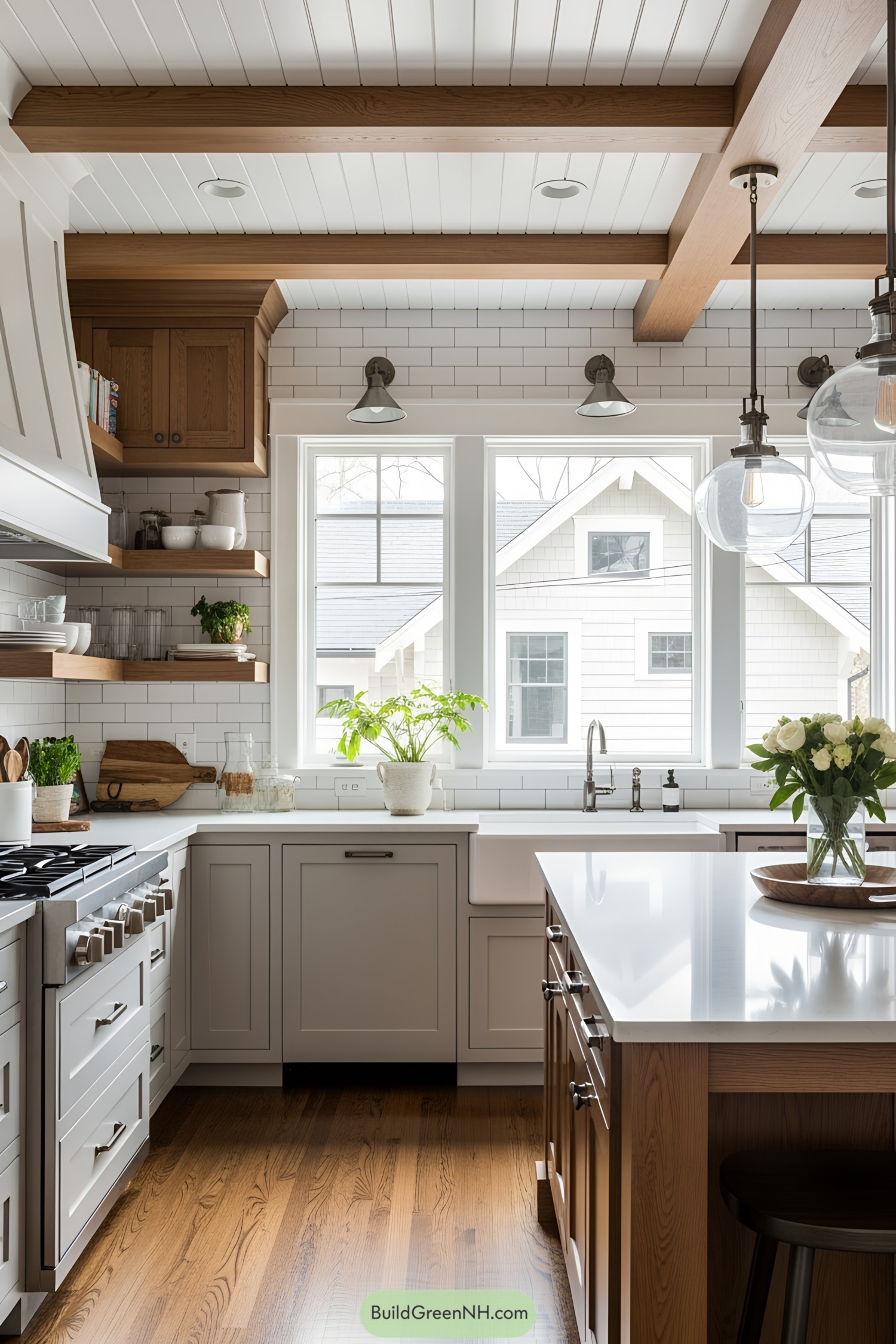 Bright modern kitchen with white cabinets, wooden accents, and big windows