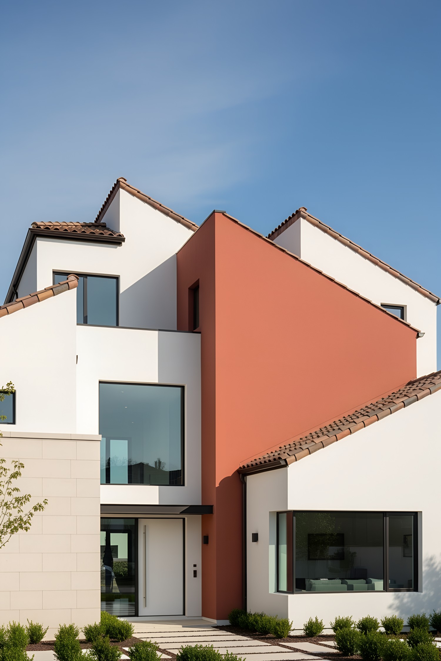 A modern villa with terracotta and white exteriors