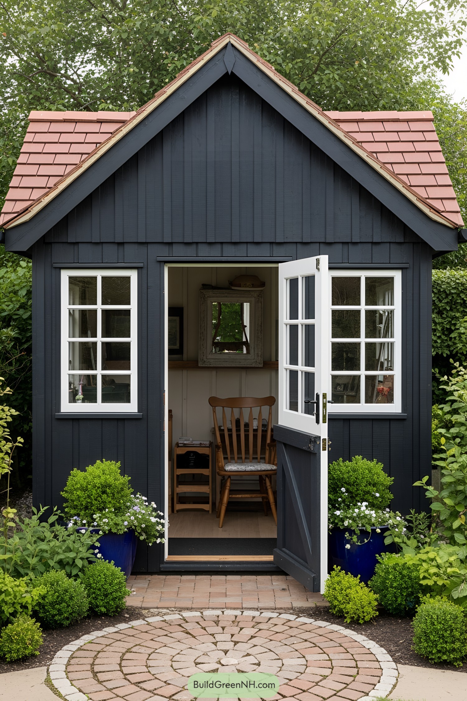 Navy blue shed with white-trimmed windows and door