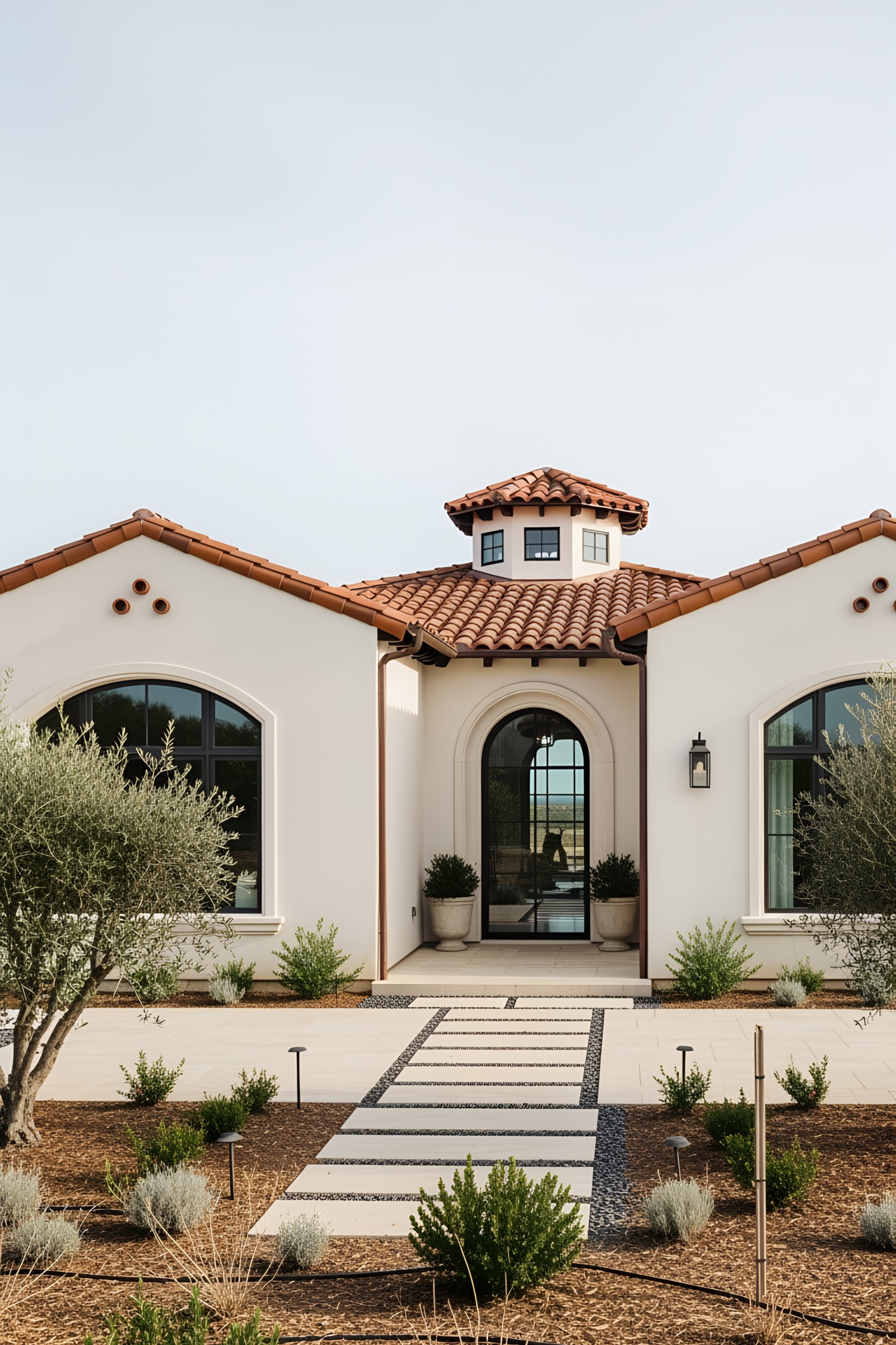 Charming coastal house with terracotta roof and arched windows