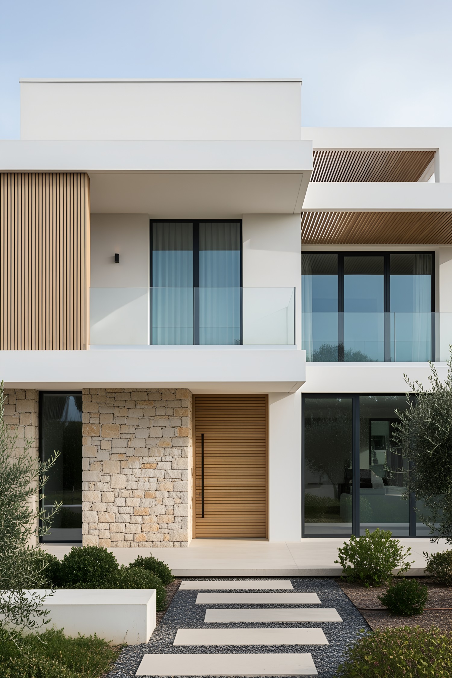 Modern coastal house with stone and wood elements