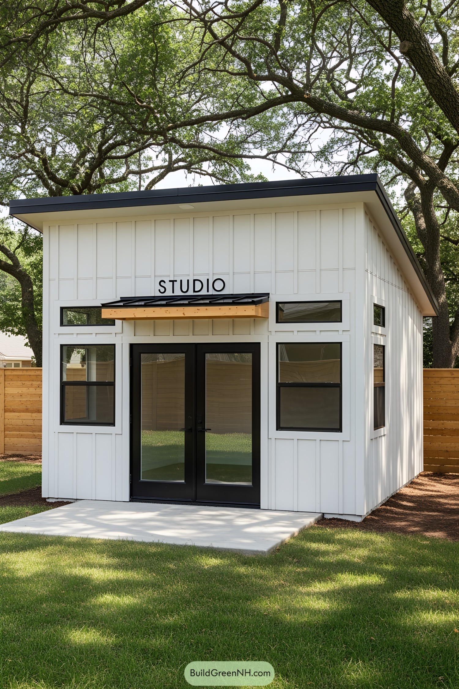 Compact studio shed with glass double doors