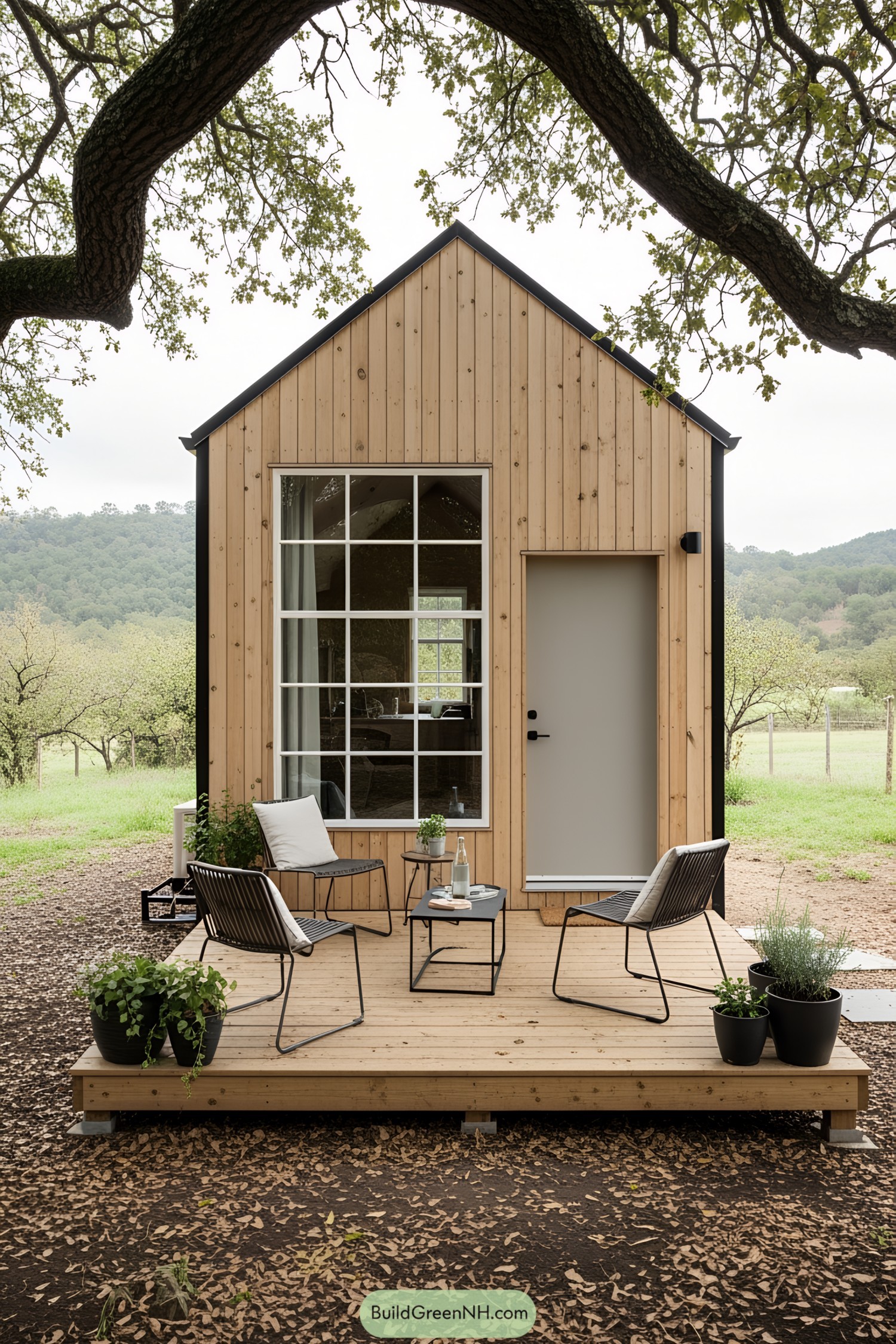 Wooden tiny house with a small deck and outdoor seating