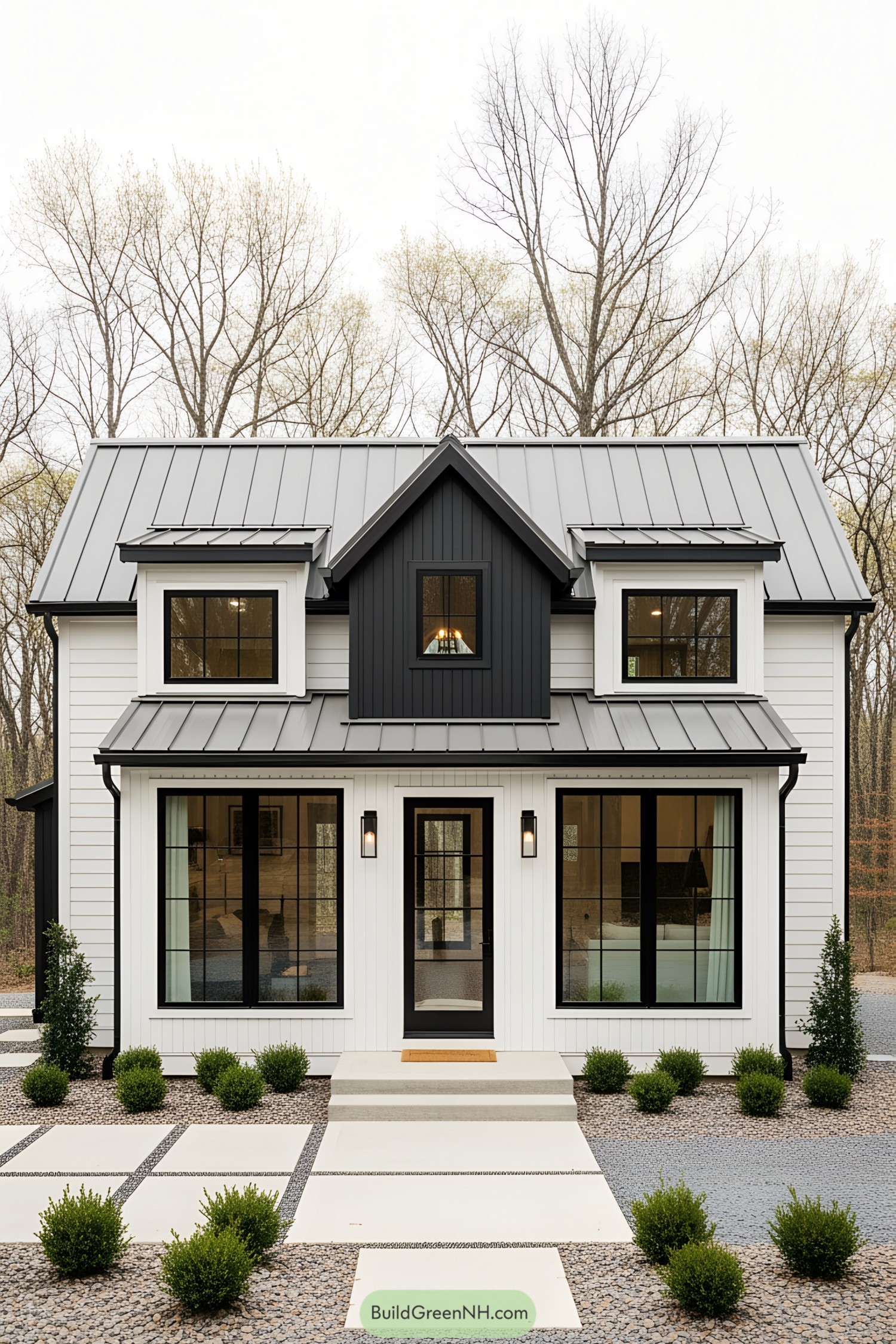 Compact modern cottage amidst bare trees