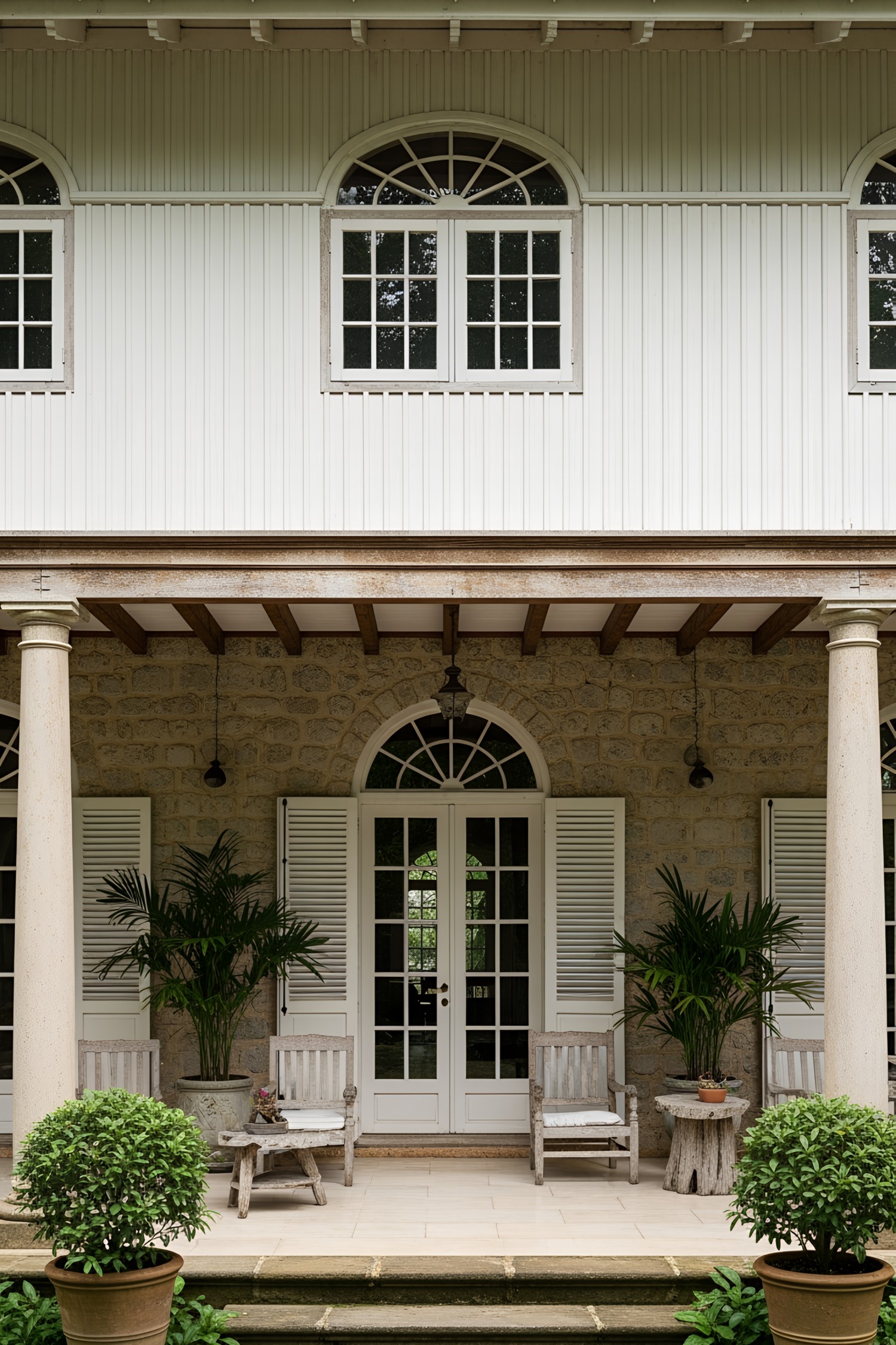 Colonial-style house with veranda and garden