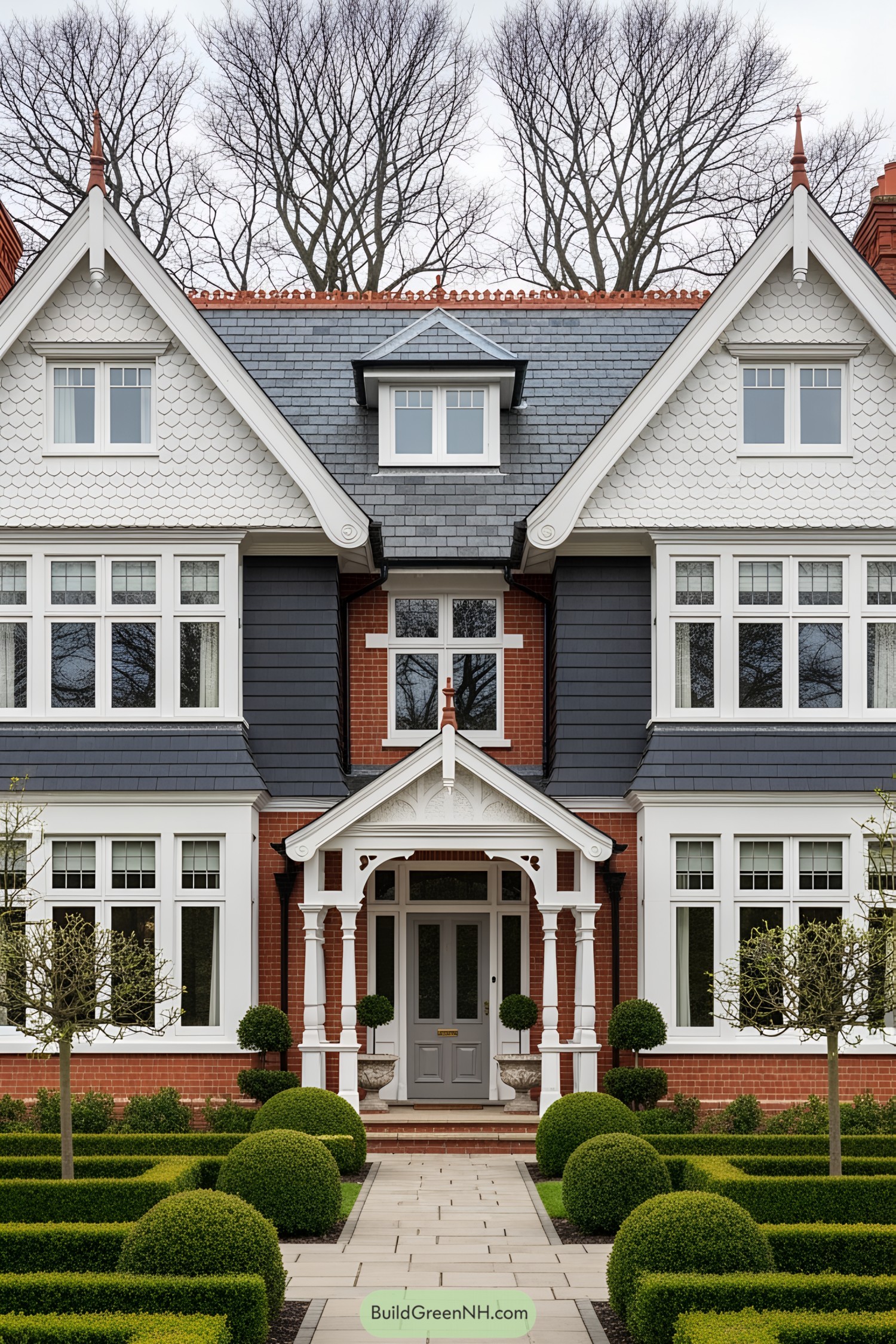 Victorian villa with ornate entrance and manicured bushes