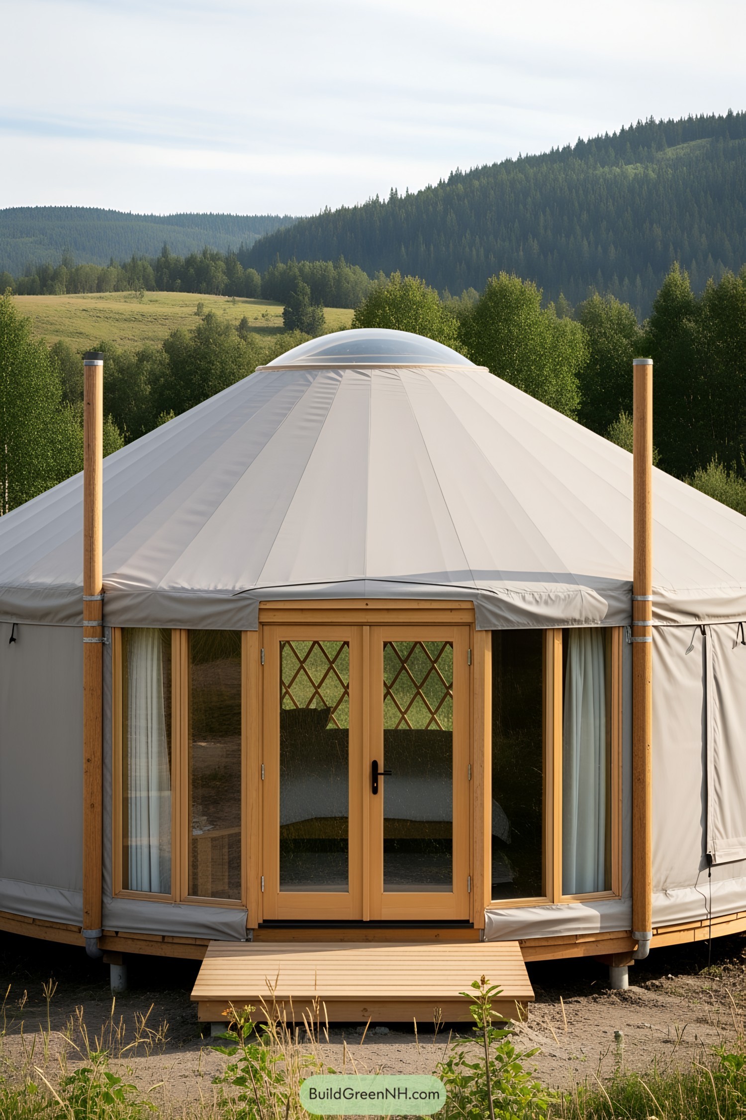 Yurt with wooden door and surrounding landscape