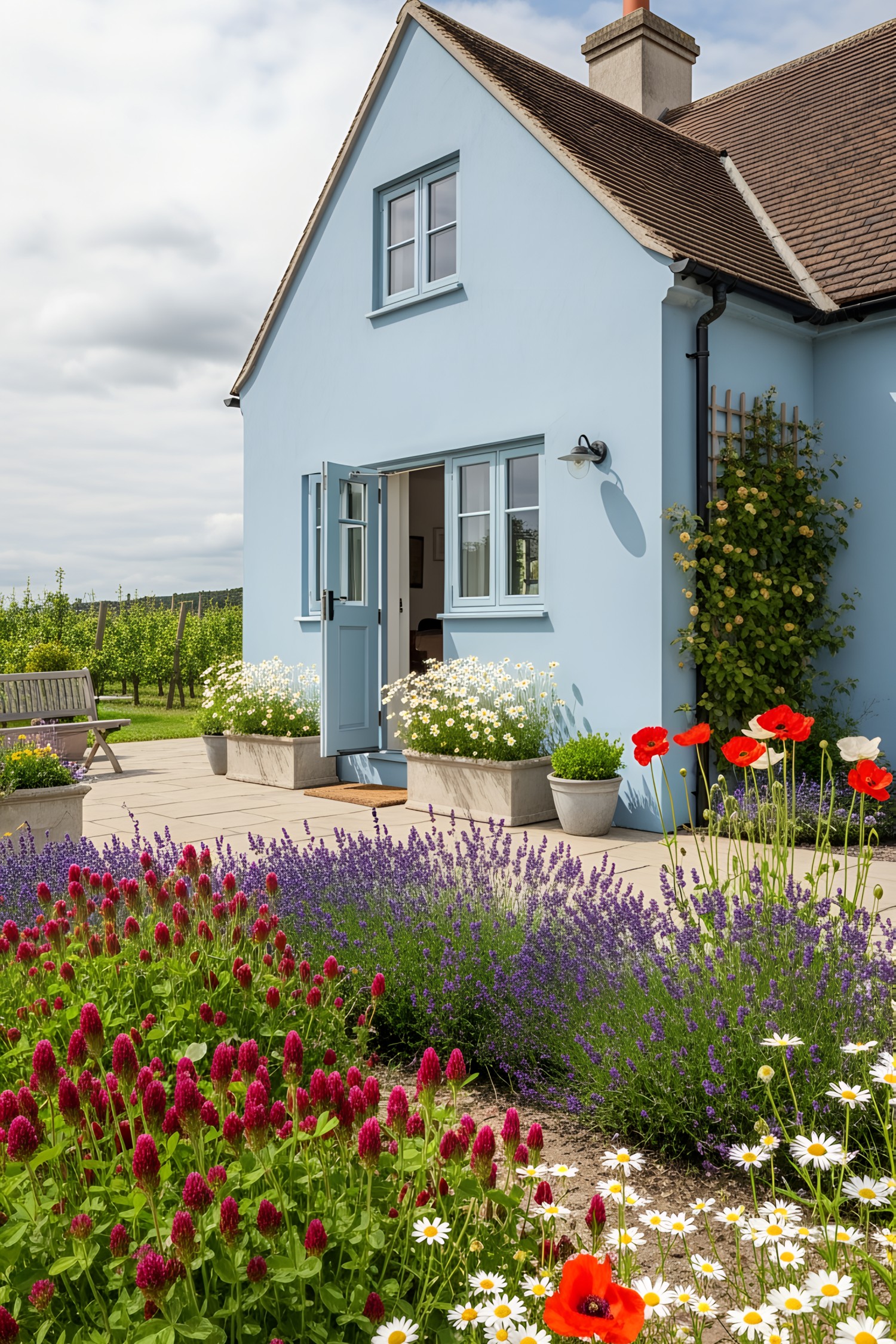 A cozy pastel blue house adorned with colorful flowers