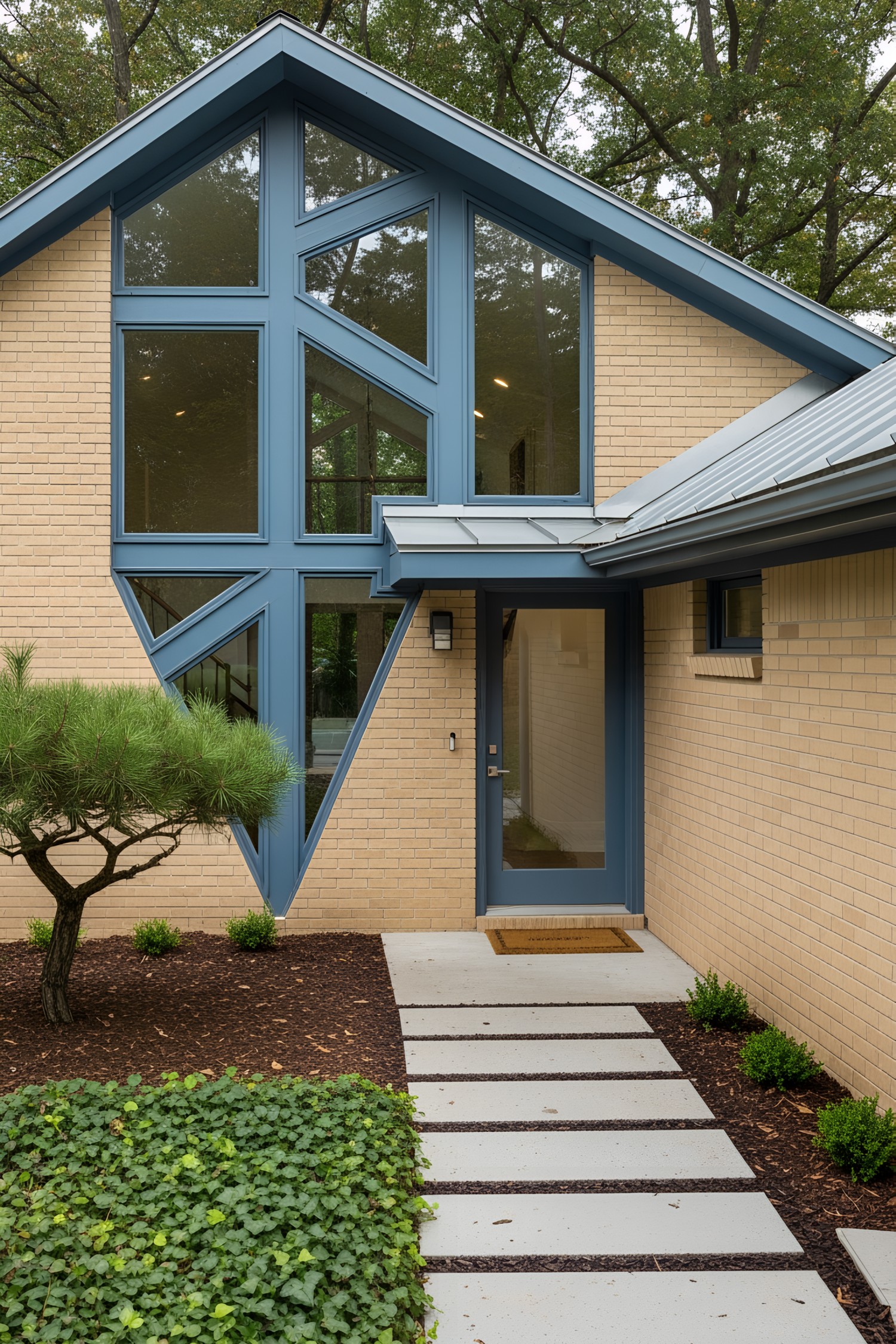 Modern house with triangular windows and blue accents