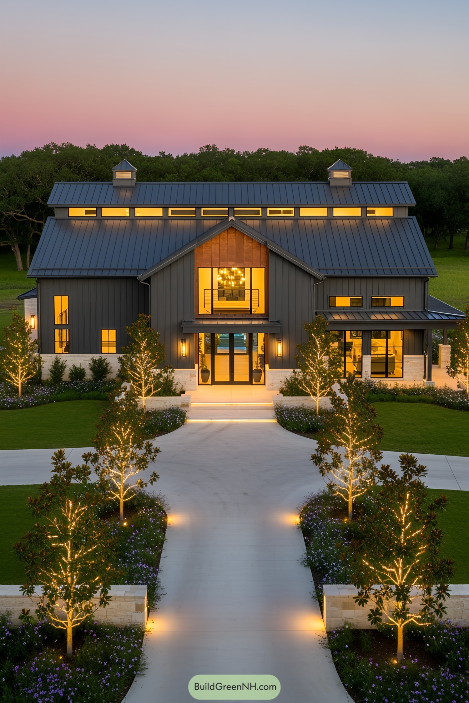 Modern barndominium lit by LED lights at sunset