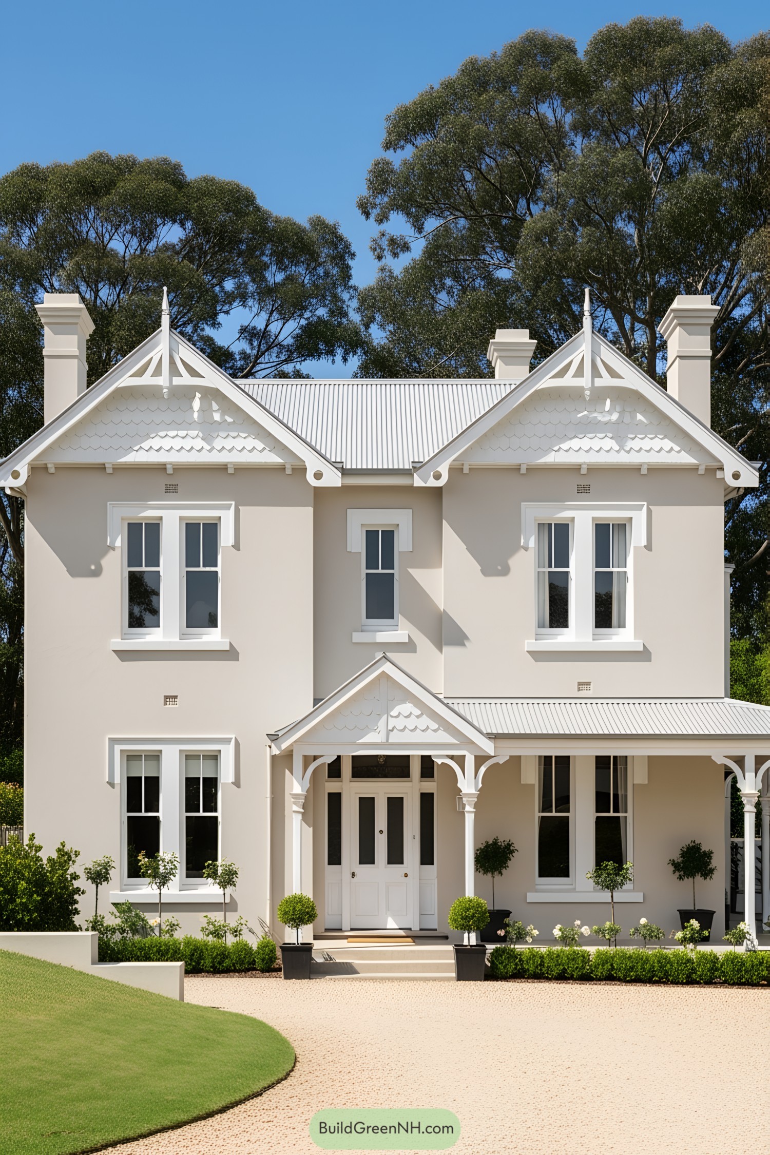 Two-story cottage with symmetrical chimneys and ornate gables