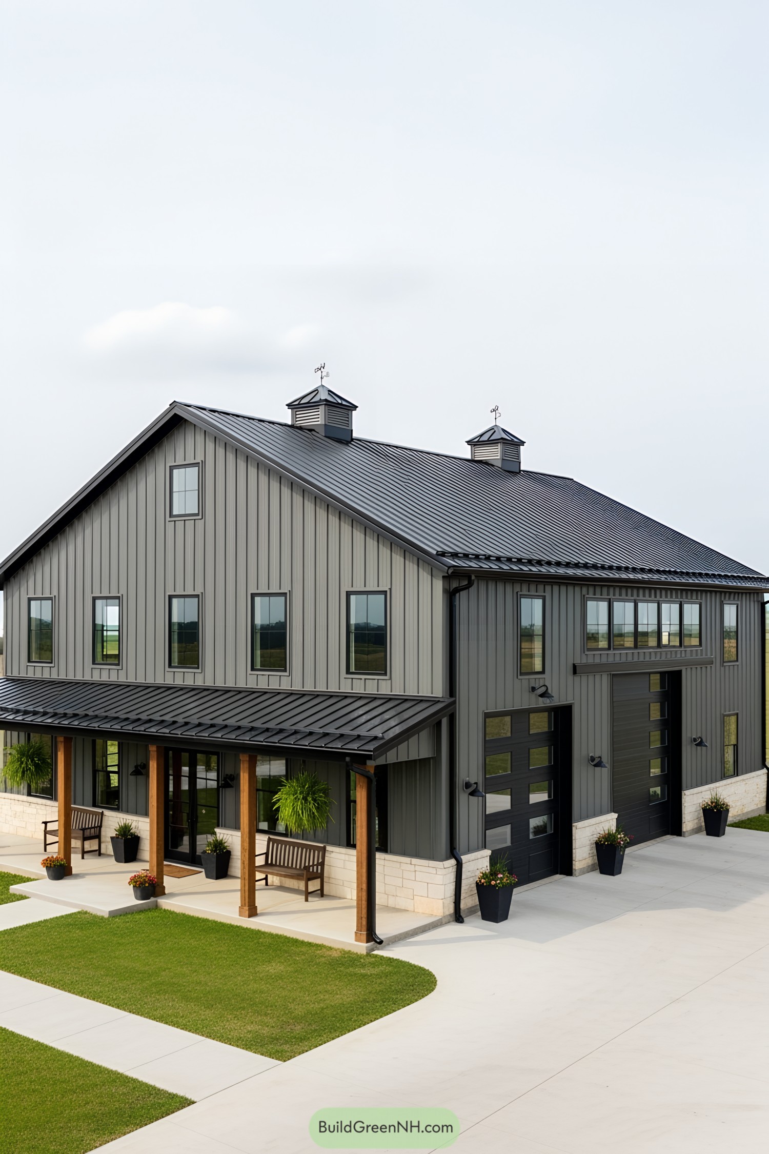 Stylish grey barndominium with large garage