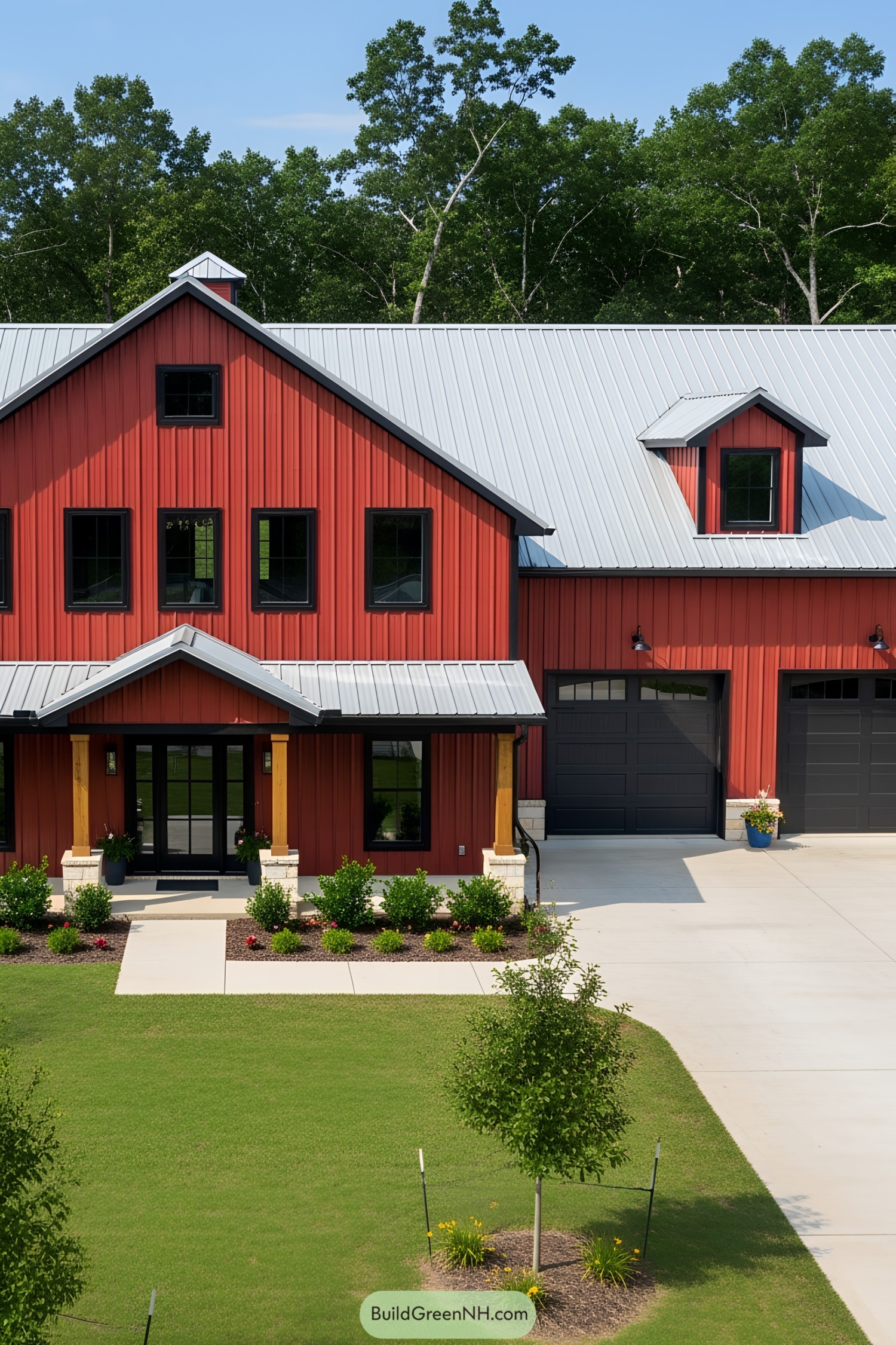 Red barndominium with modern garage and metal roof
