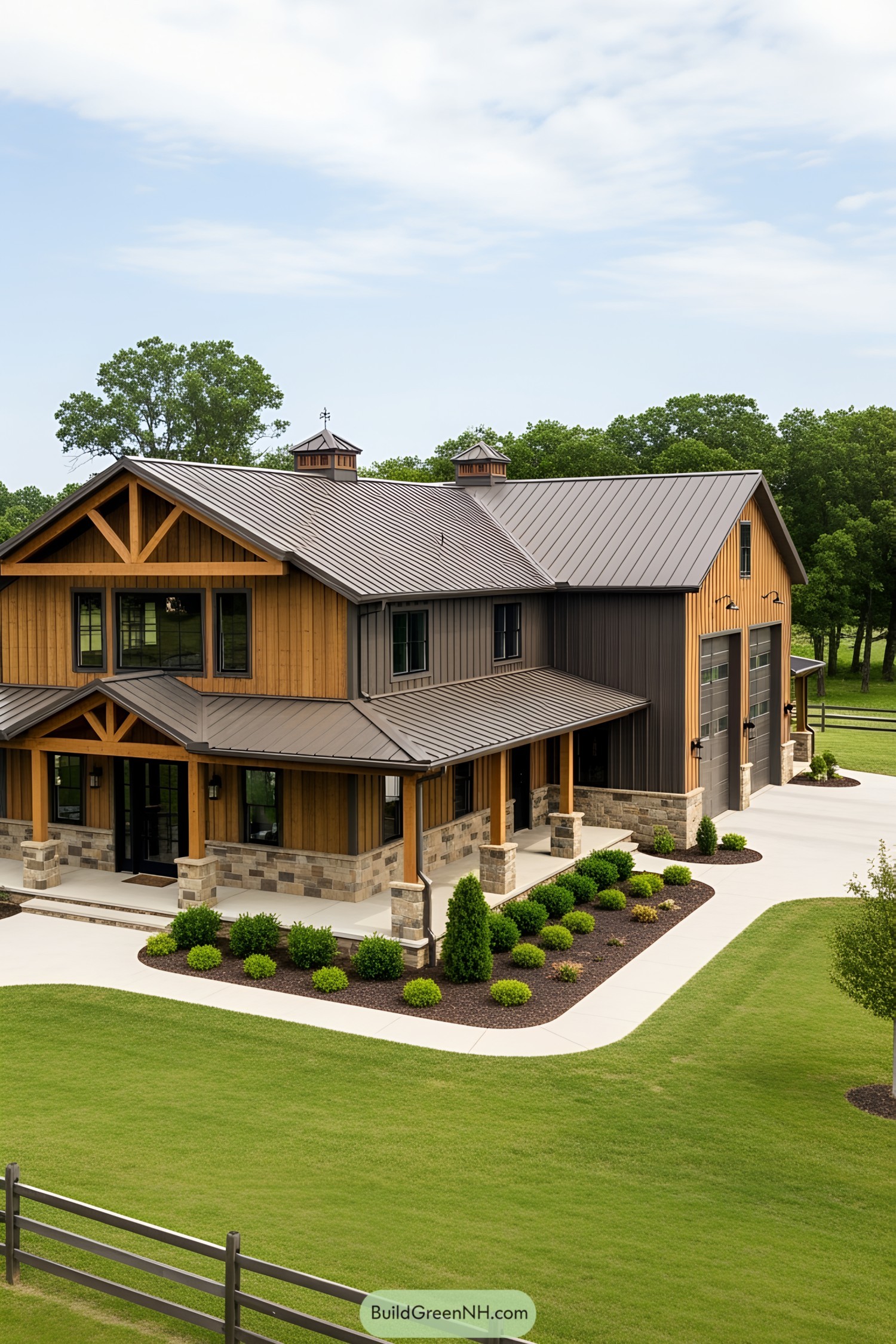 Modern barndominium with attached garage in a lush setting