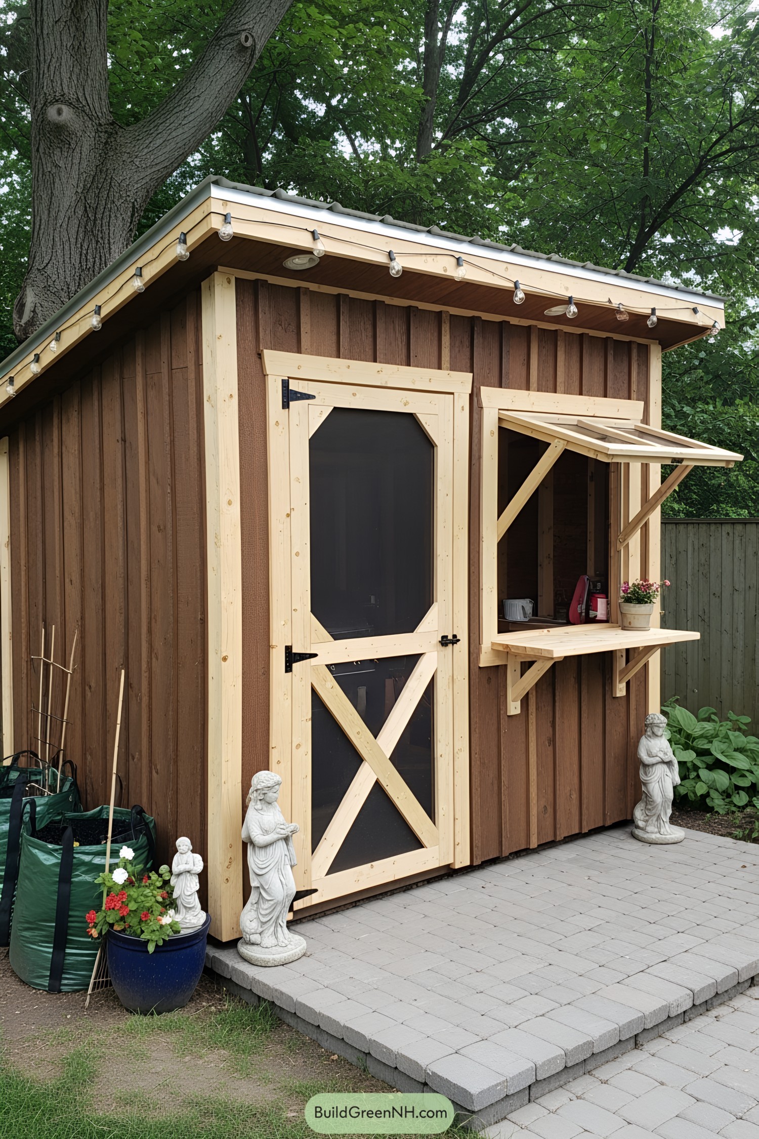 Charming wooden BBQ shed with a service window and garden statues