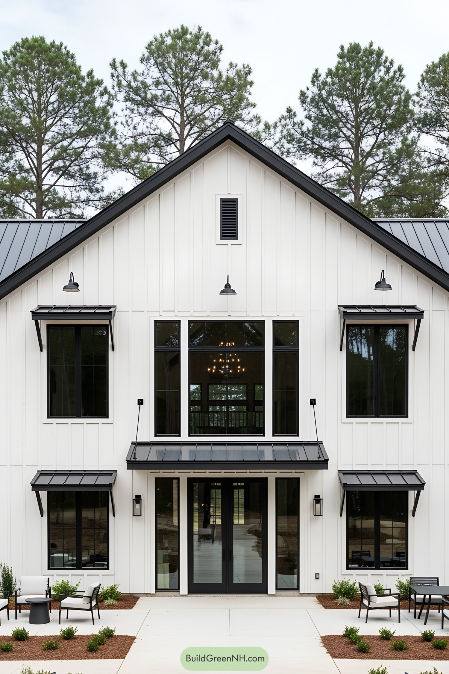 A stylish black and white barndominium with sleek metal accents and large windows