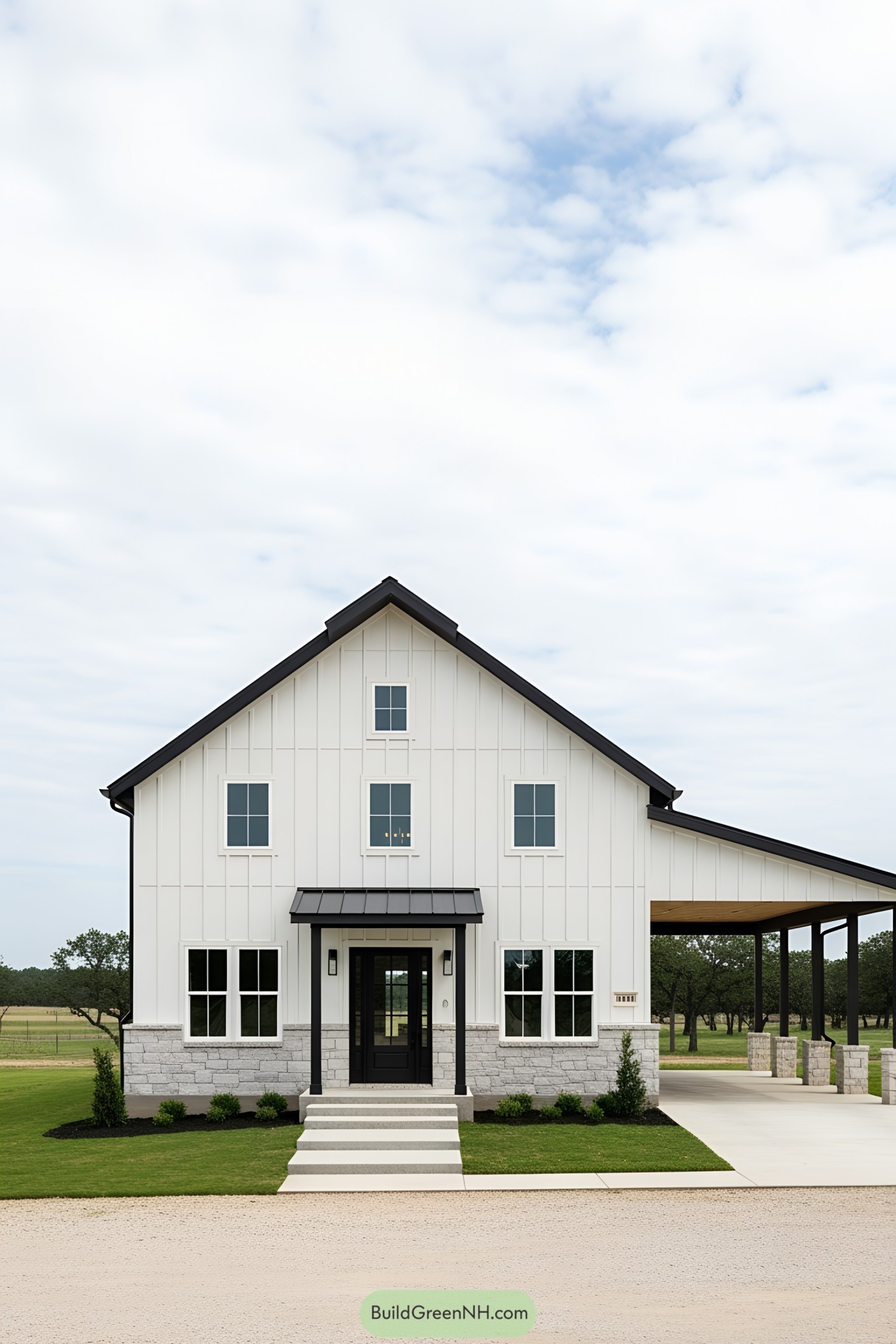 Stylish black and white barndominium front view