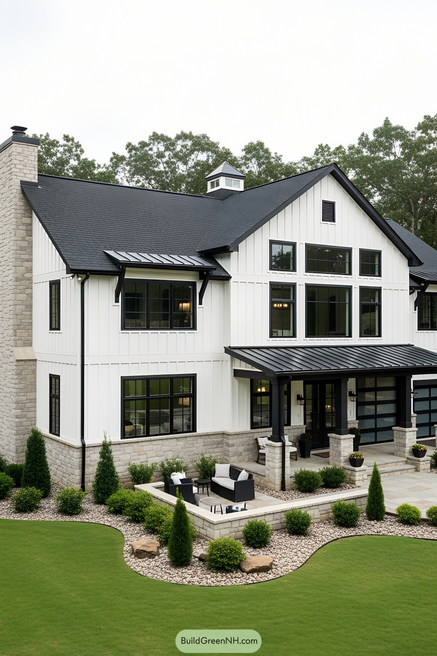 Stylish black and white barndominium with stone accents
