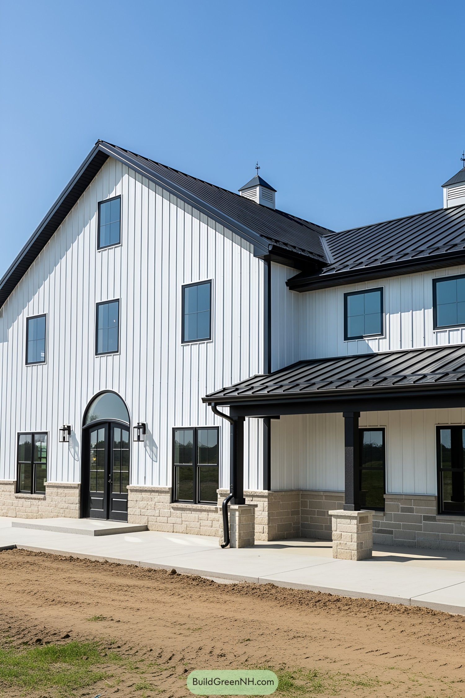 Black and white barndominium exterior with a sleek finish