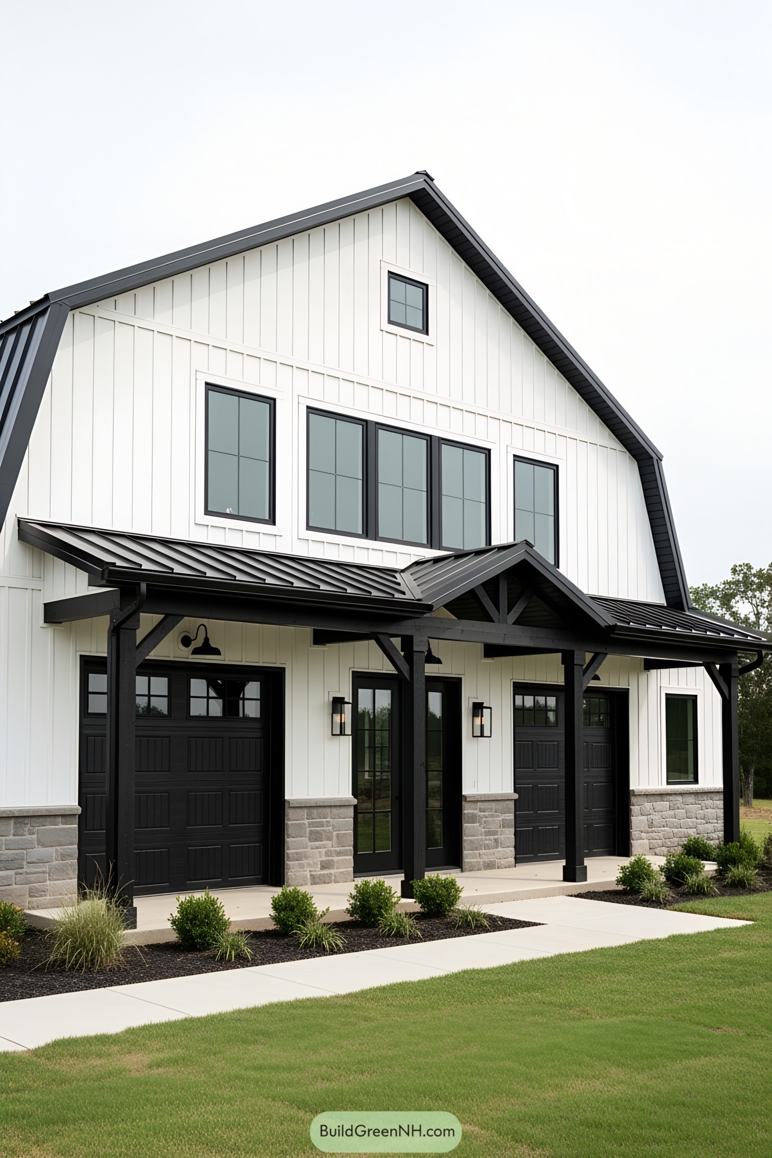 Stylish black and white barndominium with porch