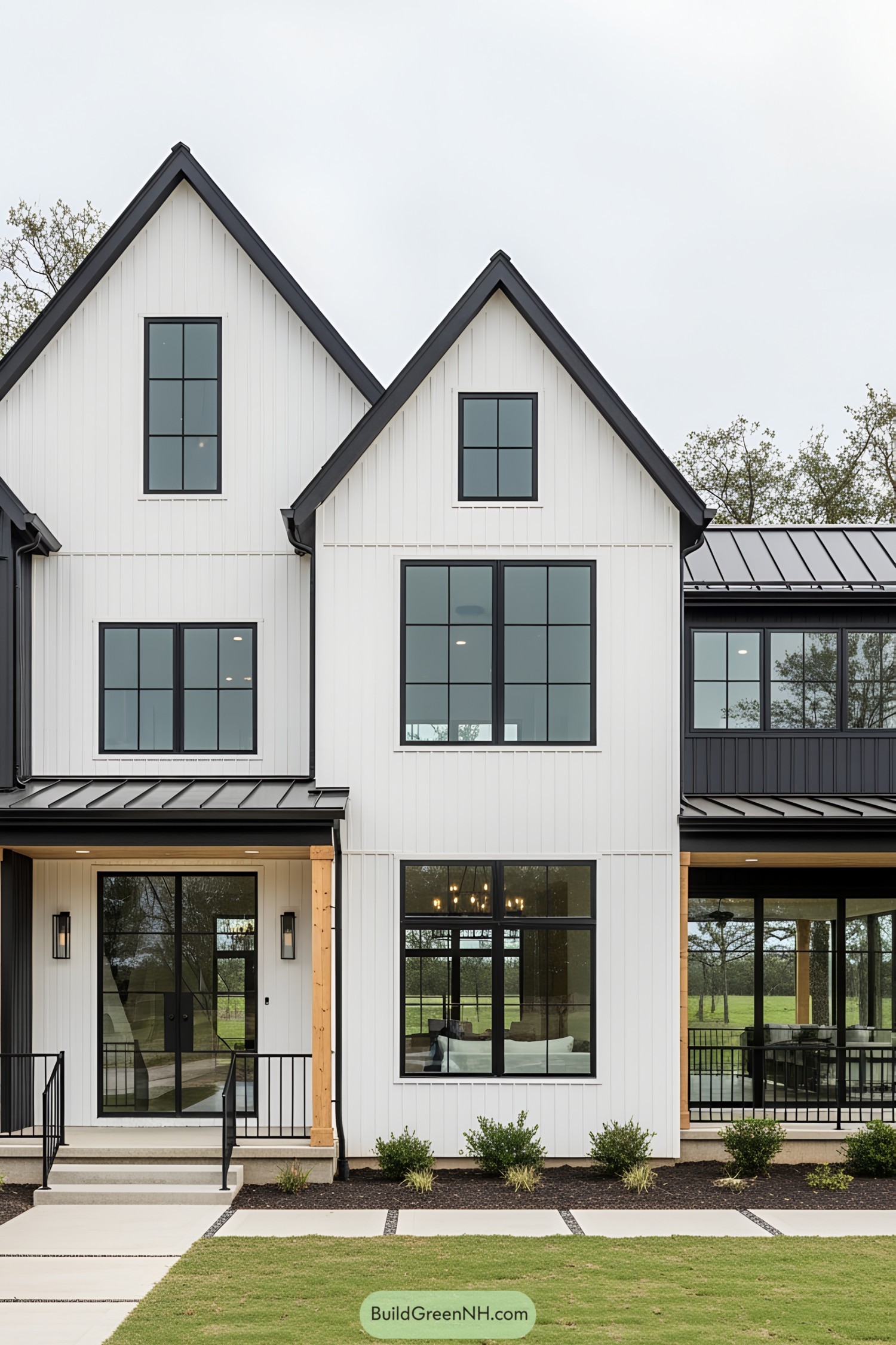 Black and white modern farmhouse with large windows