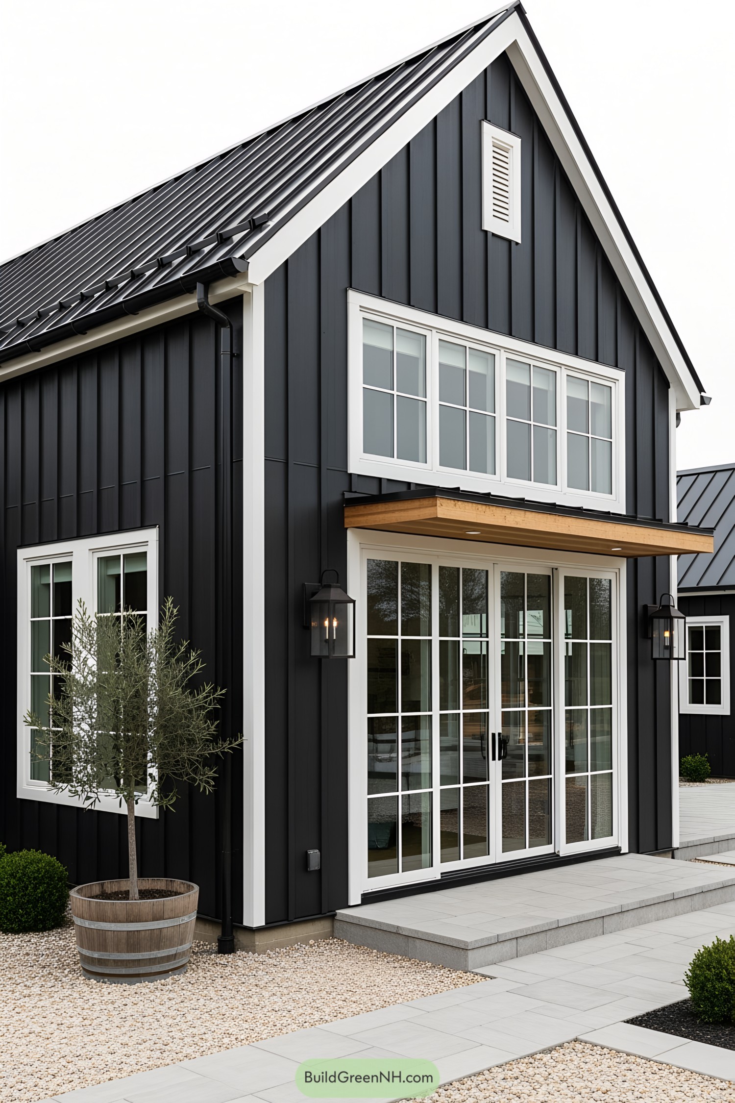 Black and white modern farmhouse with glass doors