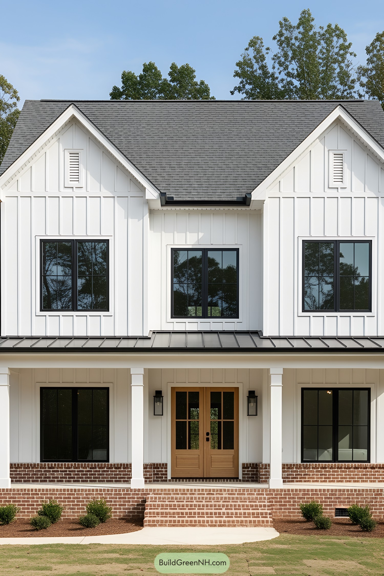 Modern farmhouse with brick detail and dark windows