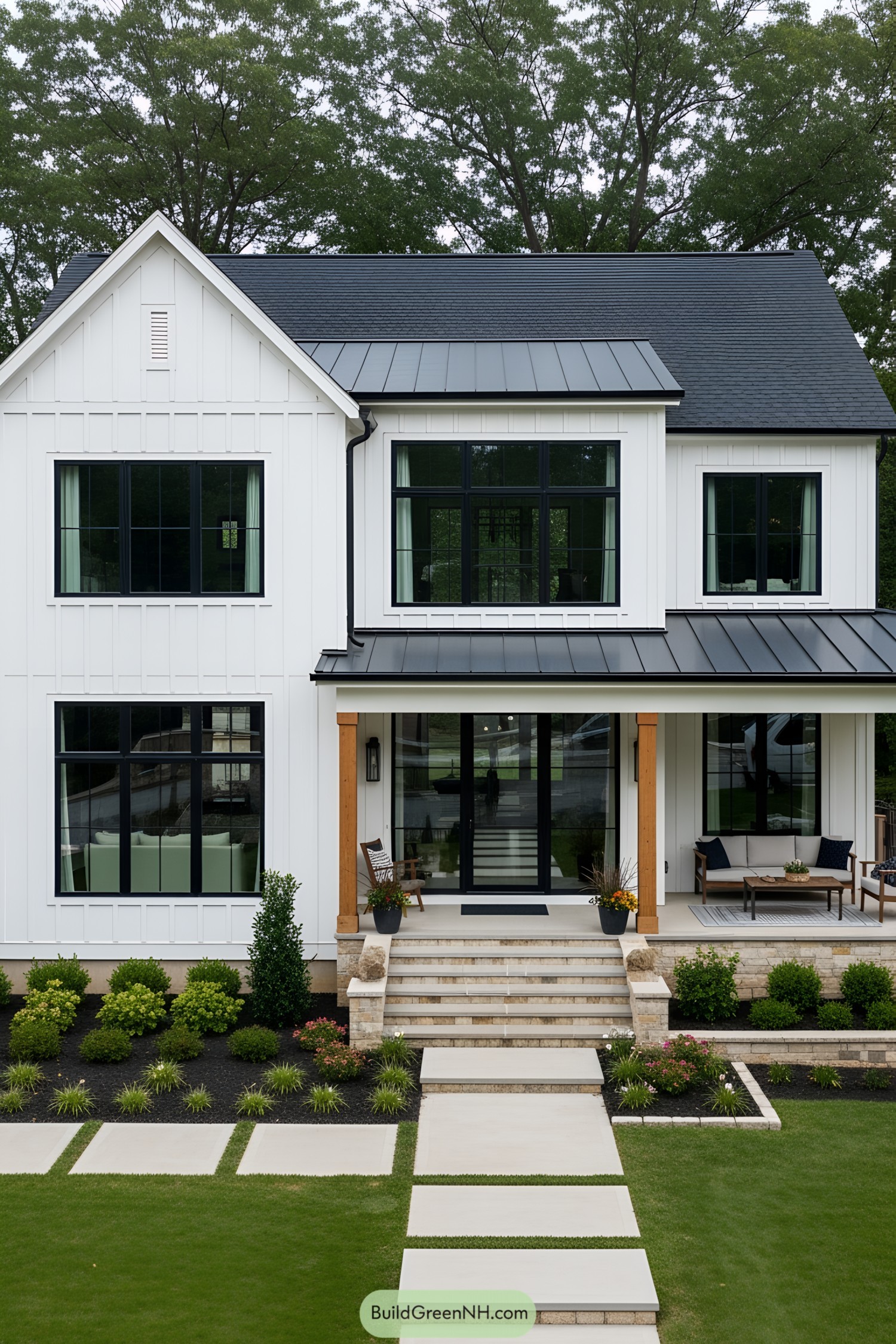 Modern black-and-white farmhouse with lush greenery