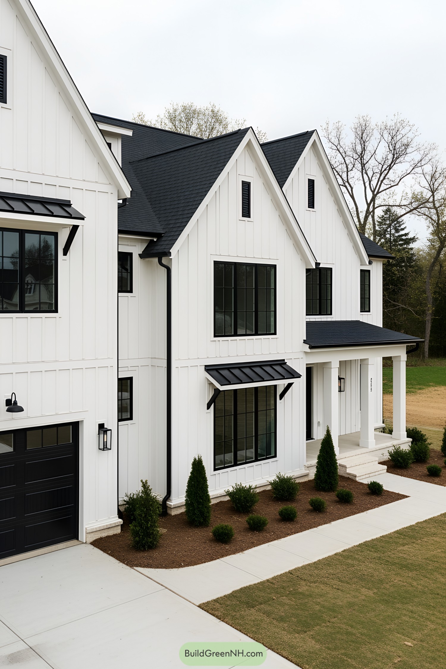 Black and white modern farmhouse with sharp angles and large windows