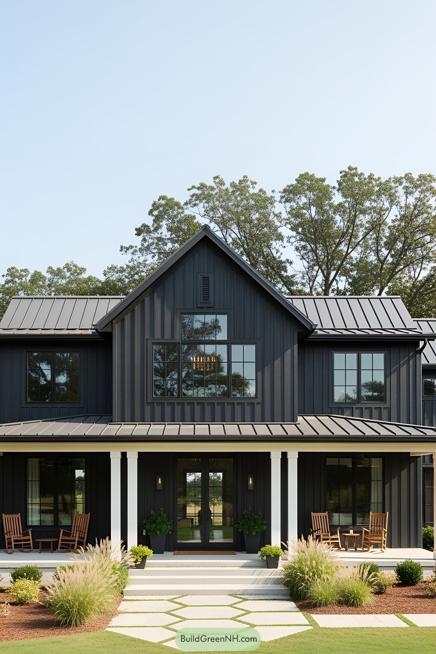 Black ranch house with lush surroundings