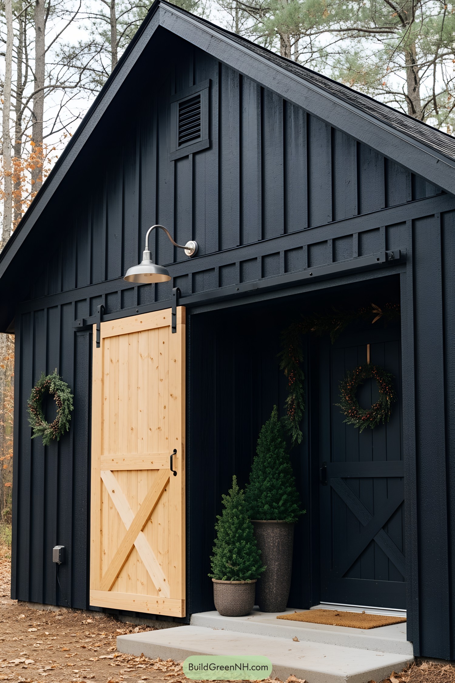 Elegant black shed with a bright wooden door and potted trees