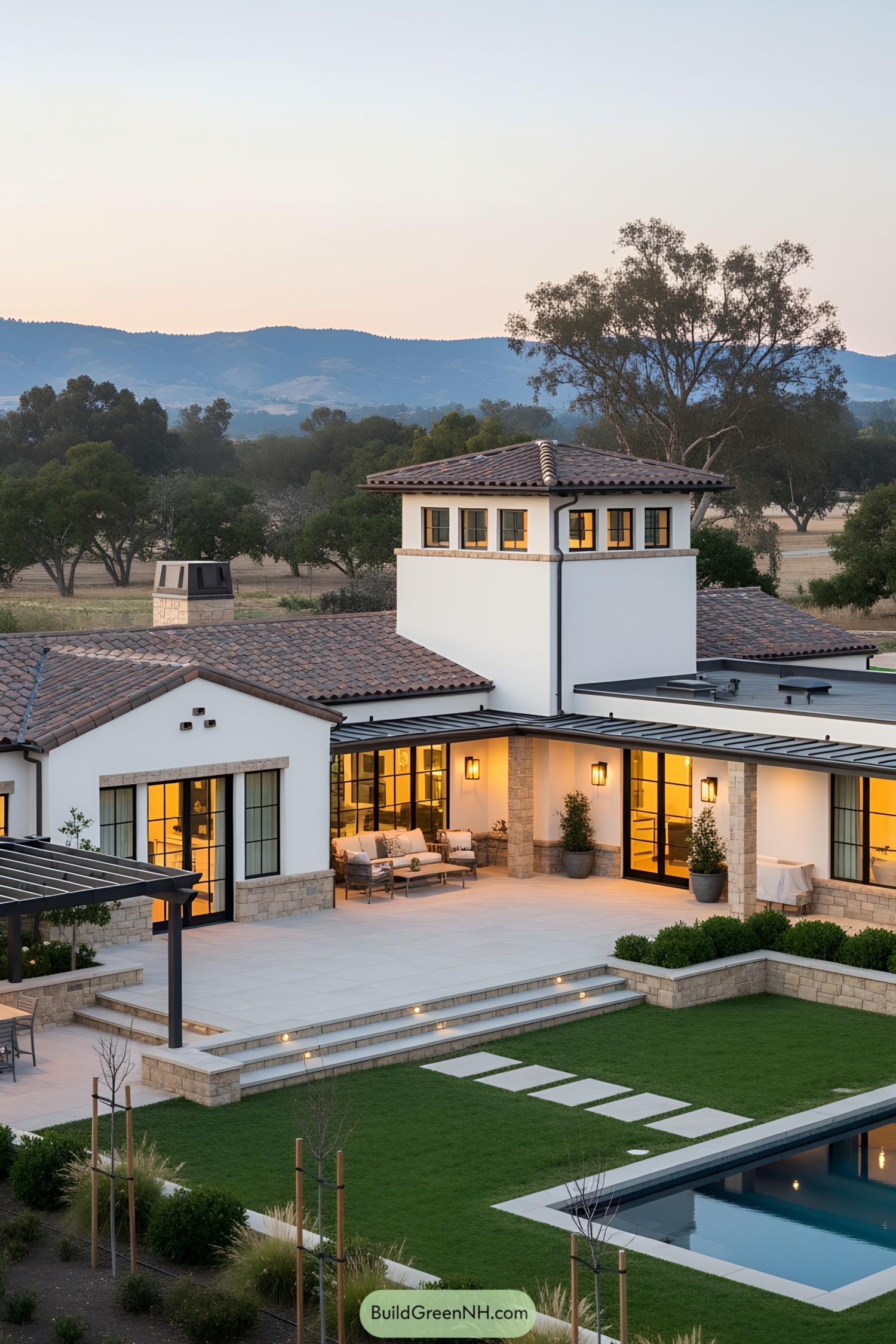 Charming ranch house at dusk, surrounded by lush greenery