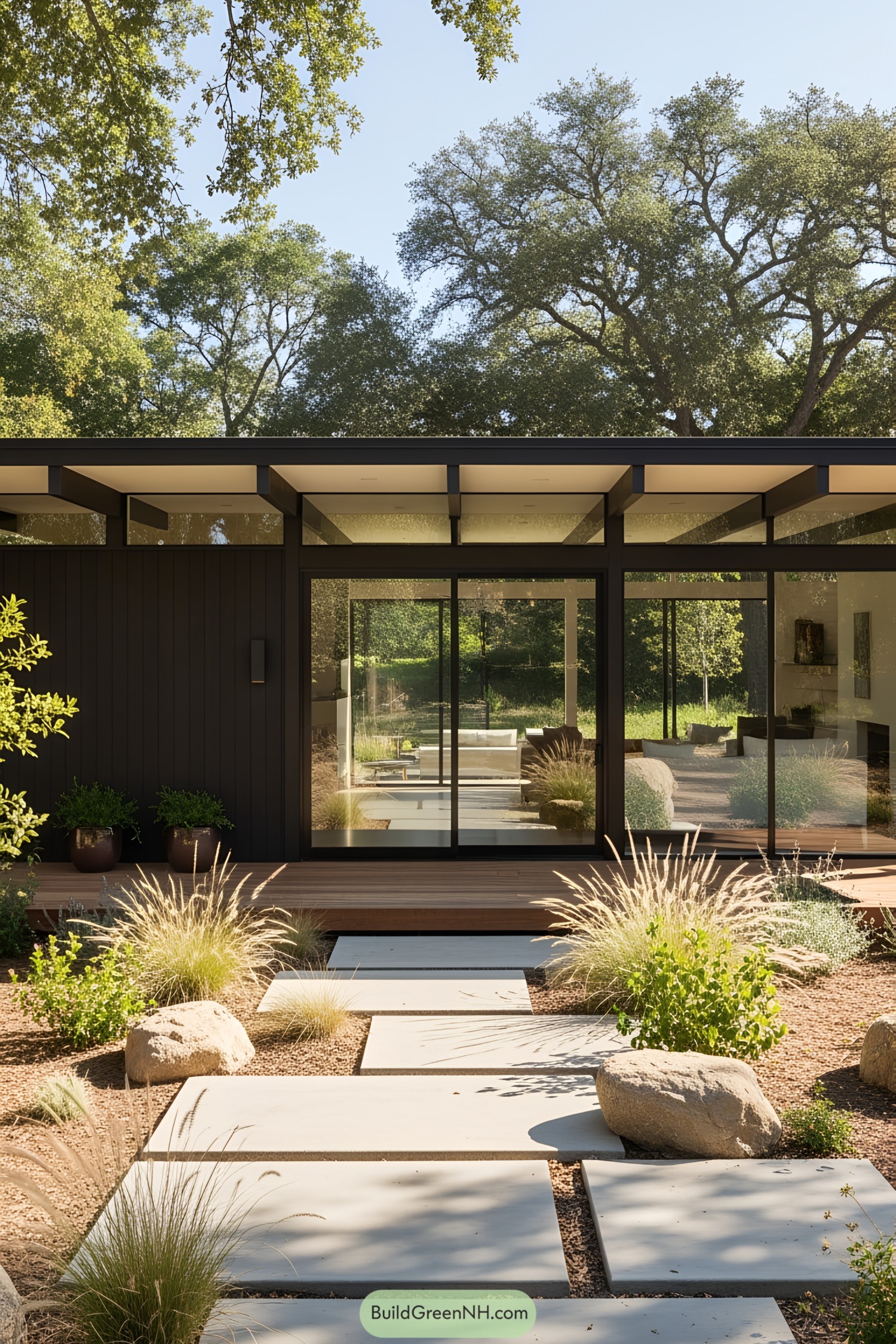Glass-fronted modern ranch house with lush landscaping