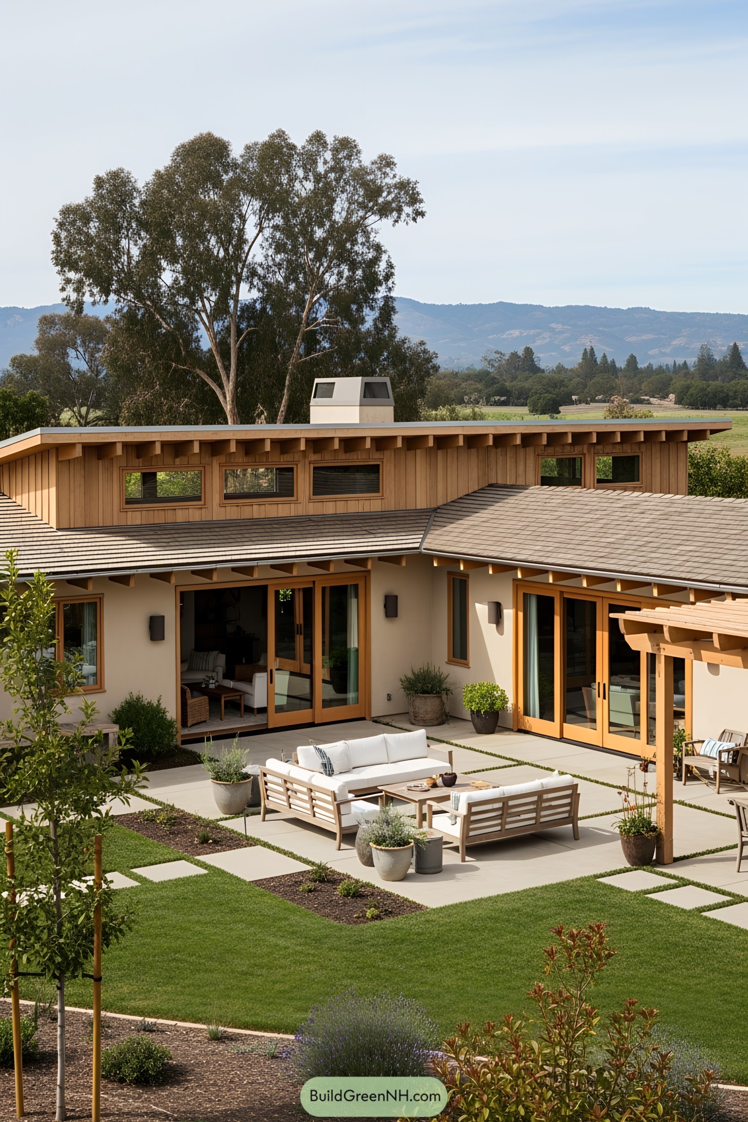 Stylish ranch house with a cozy patio and lush garden