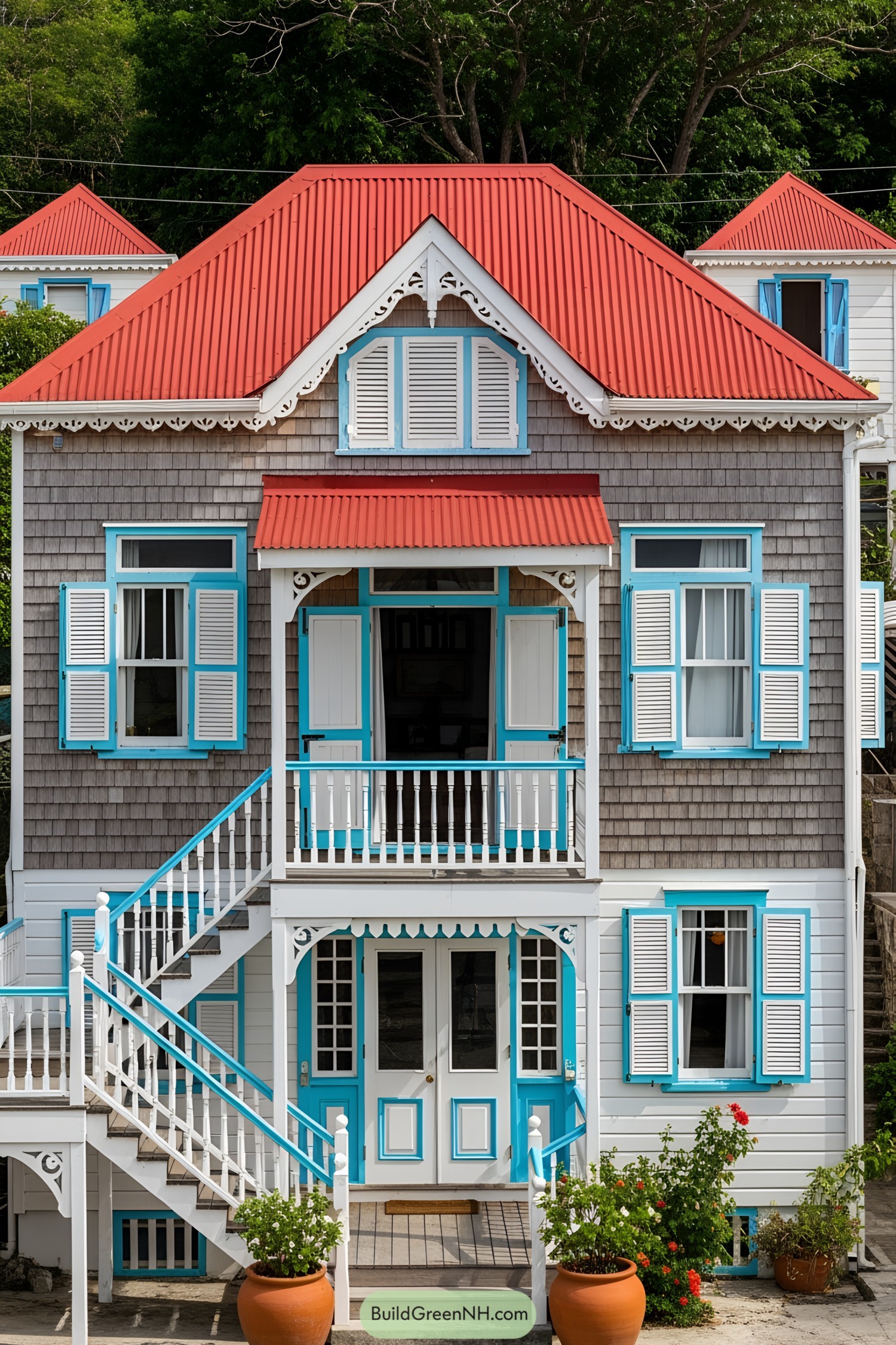 Brightly colored Caribbean house with a red roof and blue accents