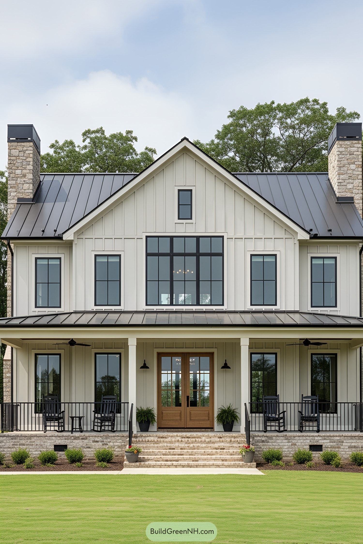 White farmhouse with a metal roof and porches