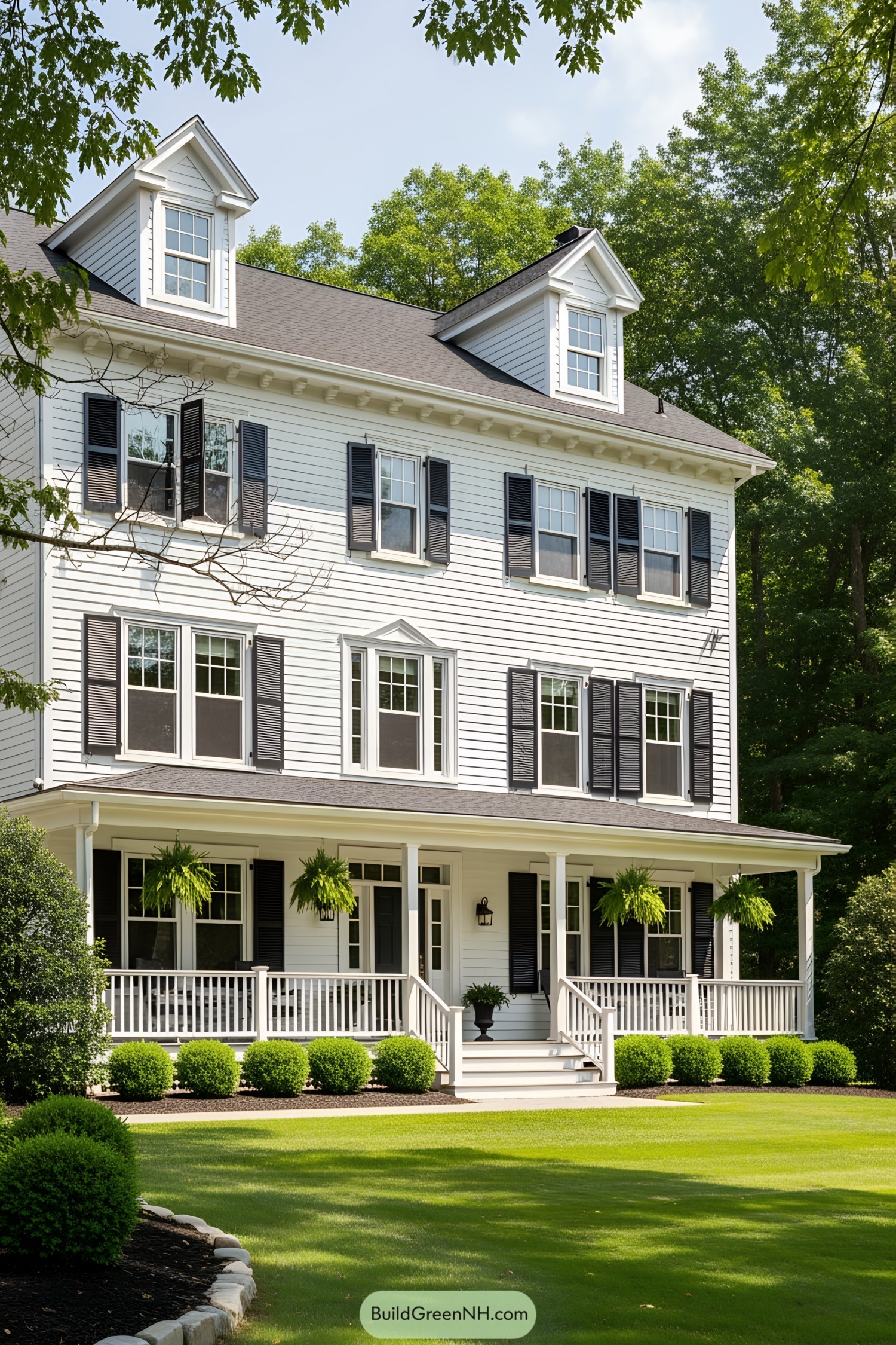 White farmhouse with black shutters and porch